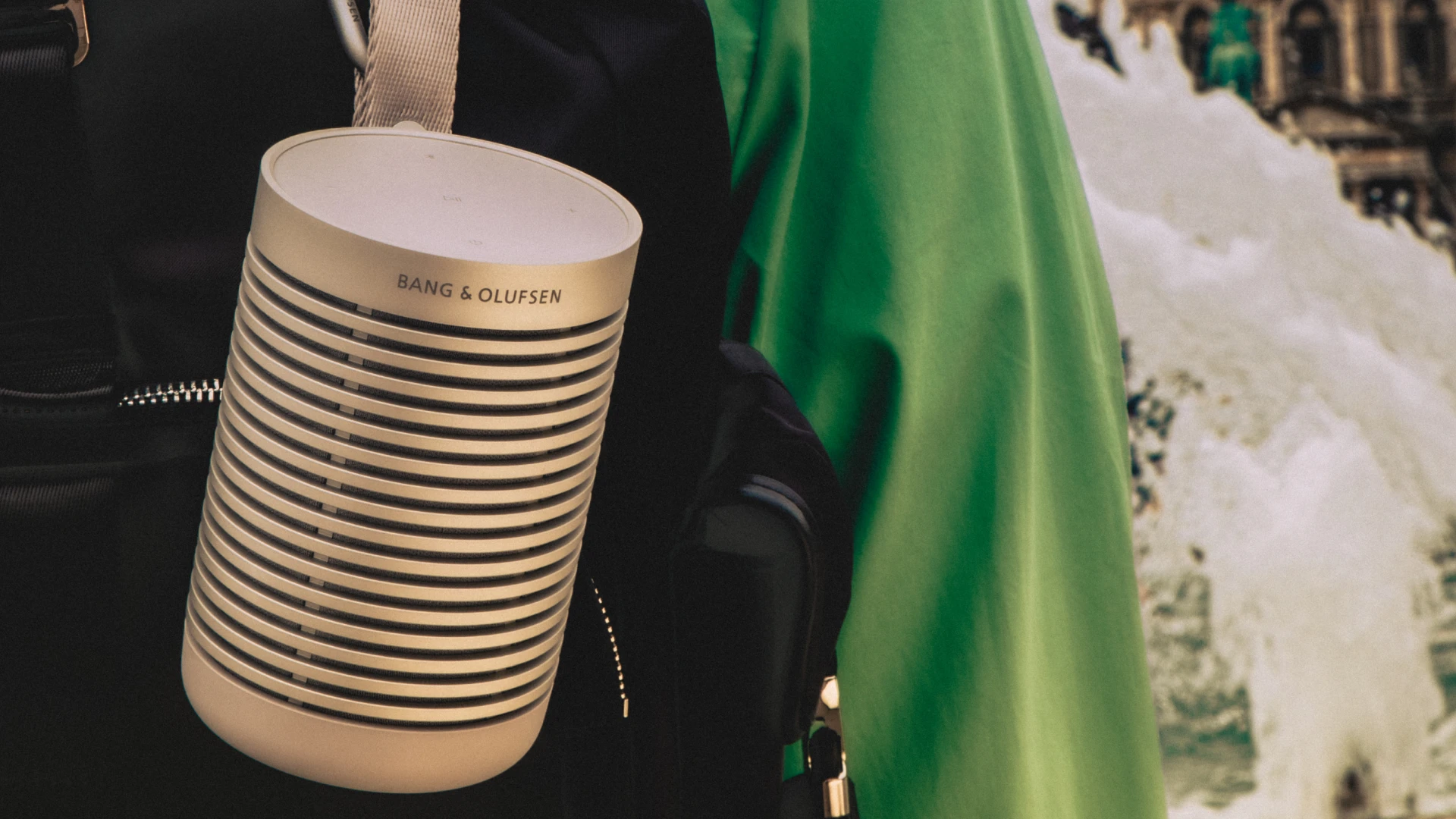 Beosound Explore Aluminium hanging on a black backpack