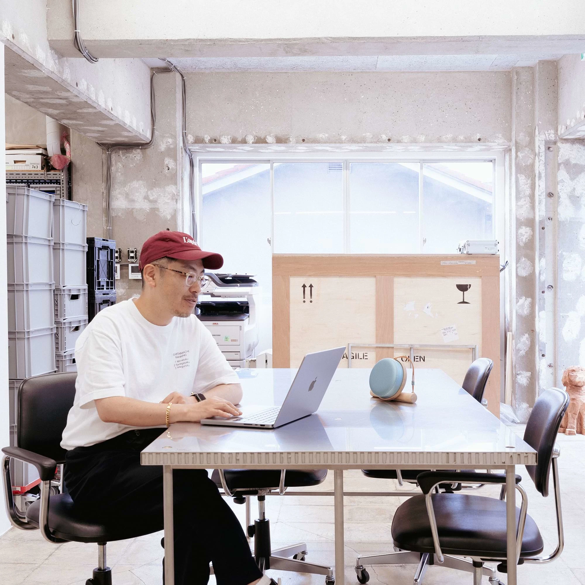 Maeda sitting with a computer and the Beosound A1