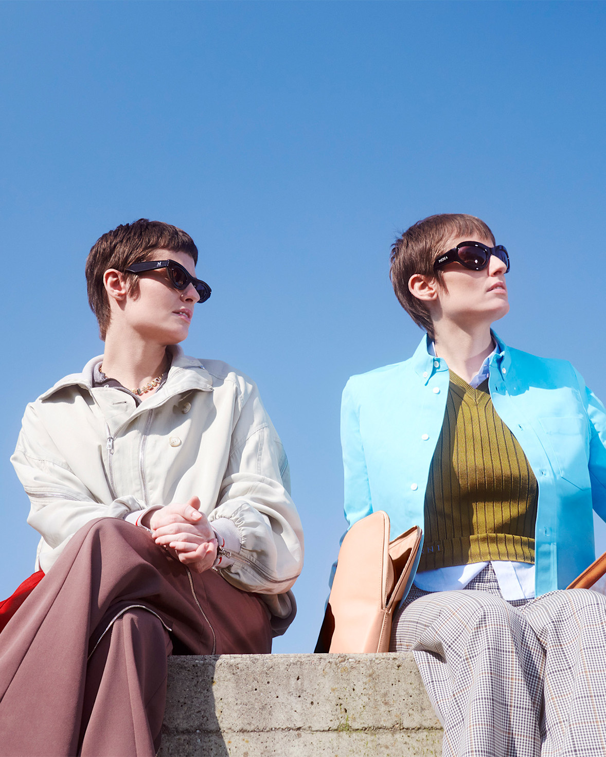 Medea sisters sitting in the park with their dog