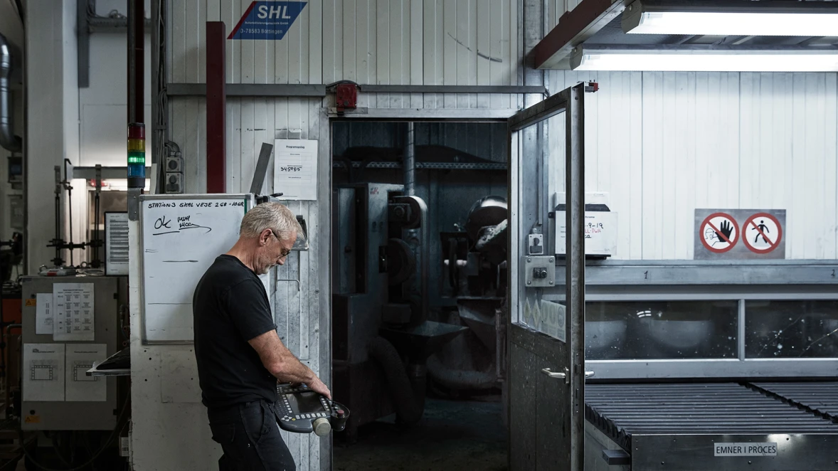 Finn in the factory operating some machines