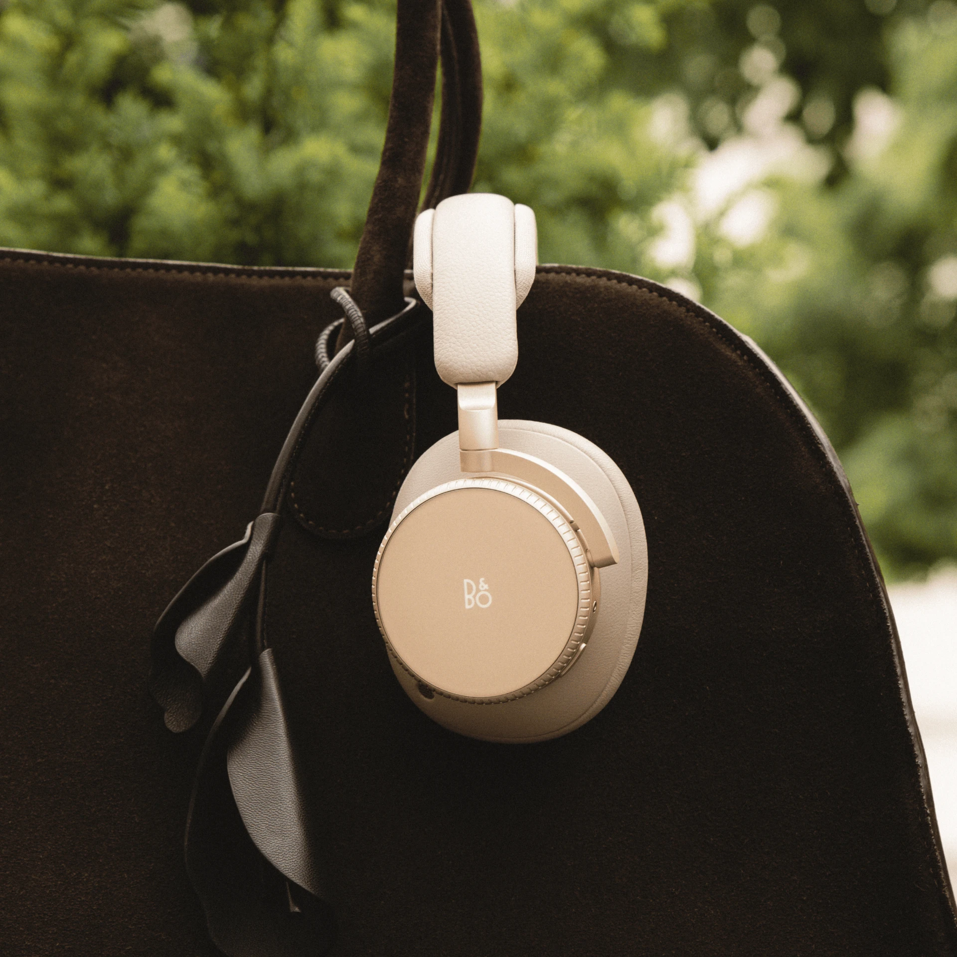 Beoplay H100 placed on a suitcase