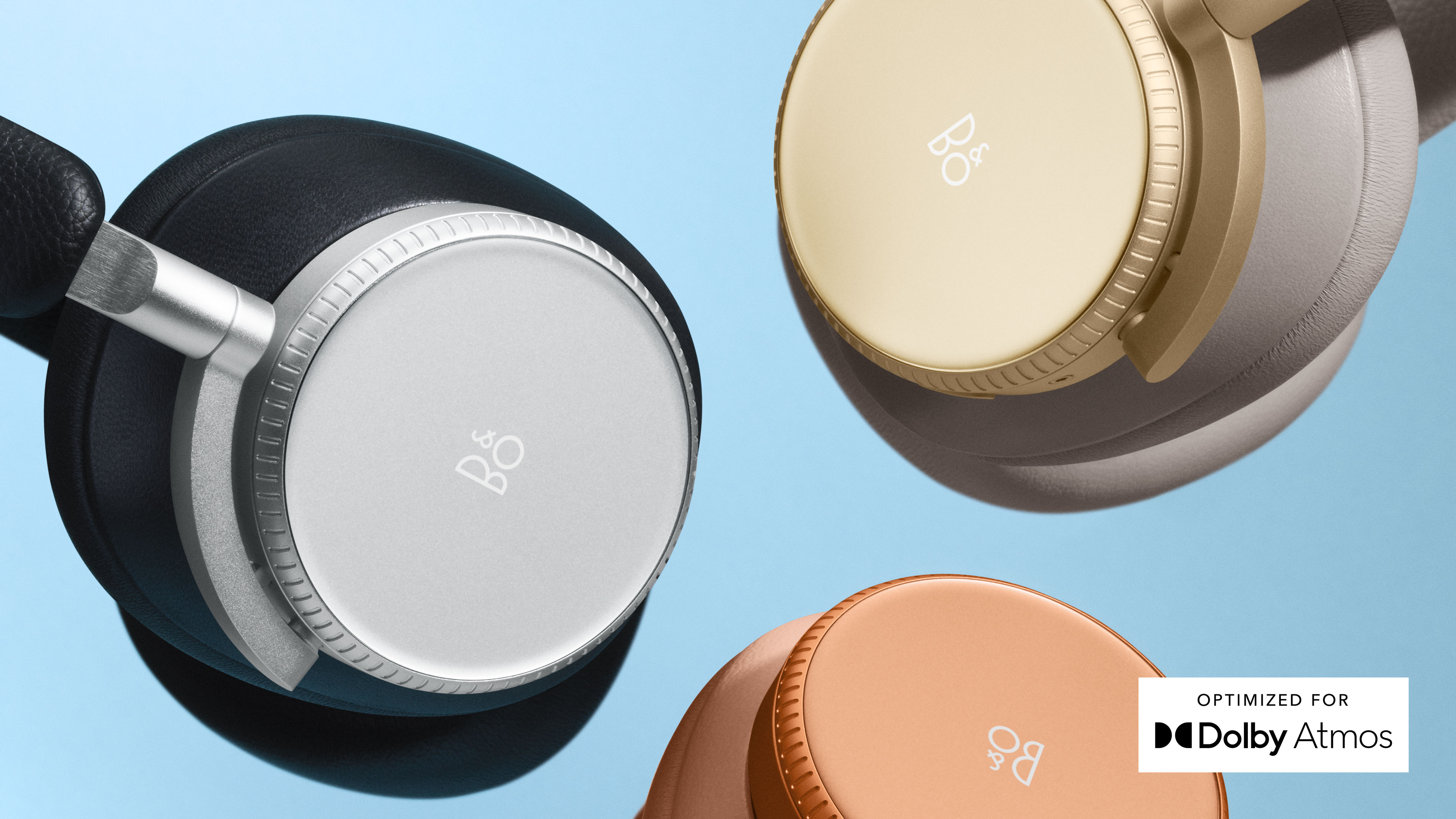 Detail shot of Beoplay H100 headphones in the colours Infinite Black, Hourglass Sand and Sunset Apricot