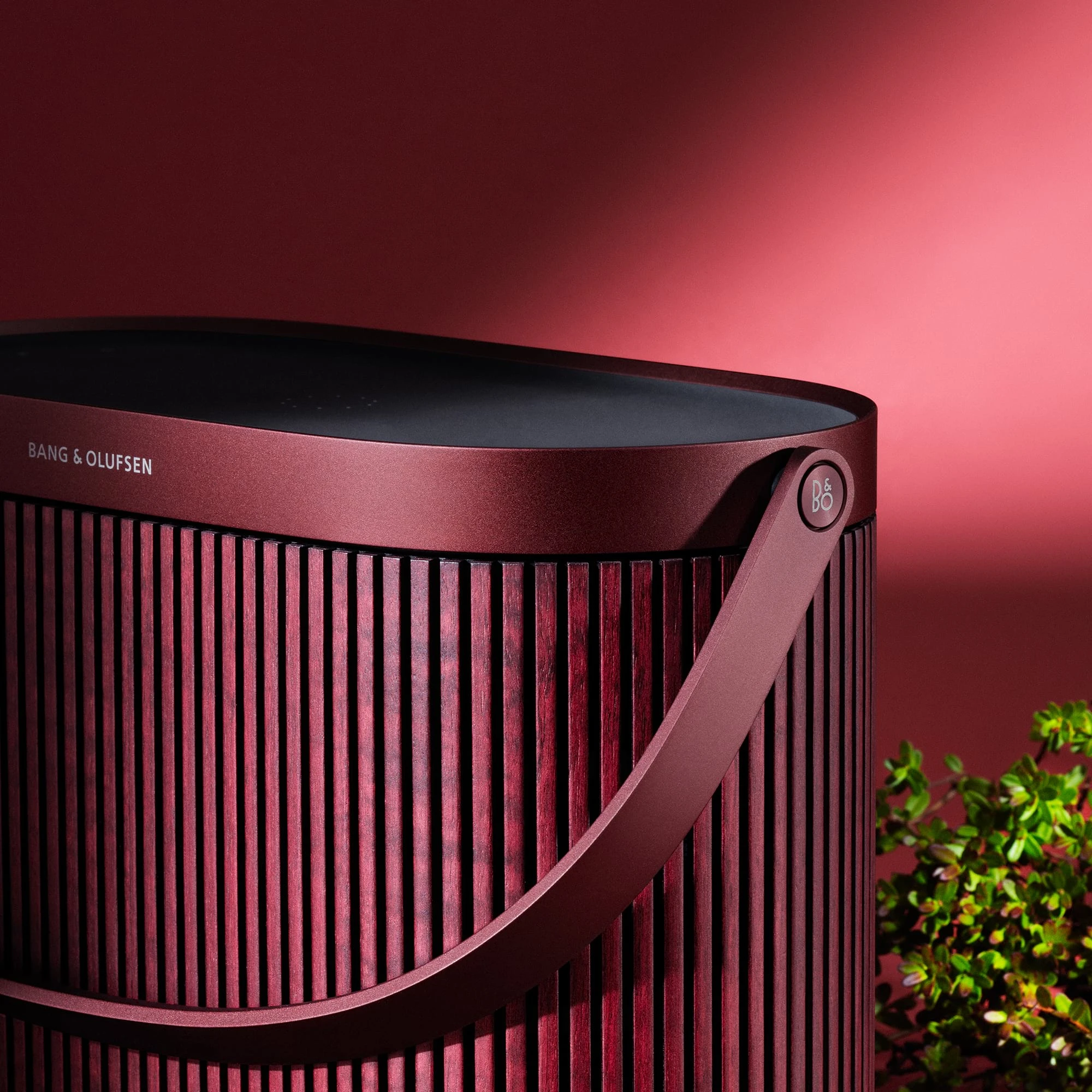 Close-up of the Beosound A5 Cranberry Red