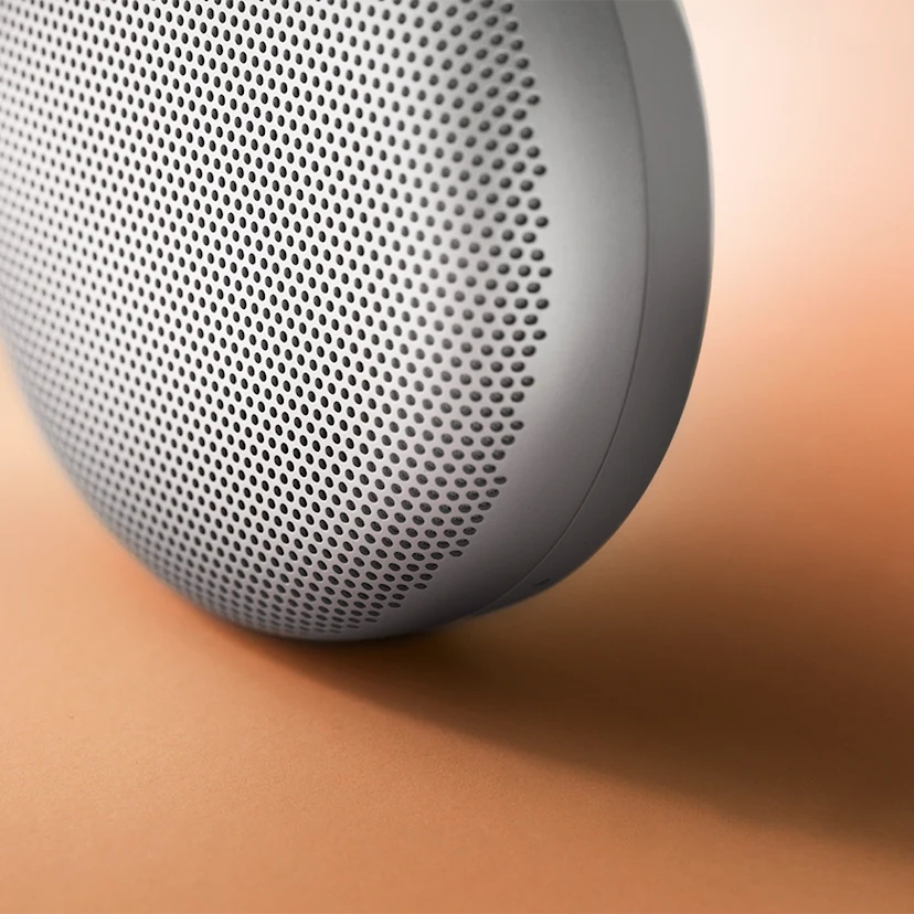 Beosound A1 in grey mist with it's detailed aluminium grill