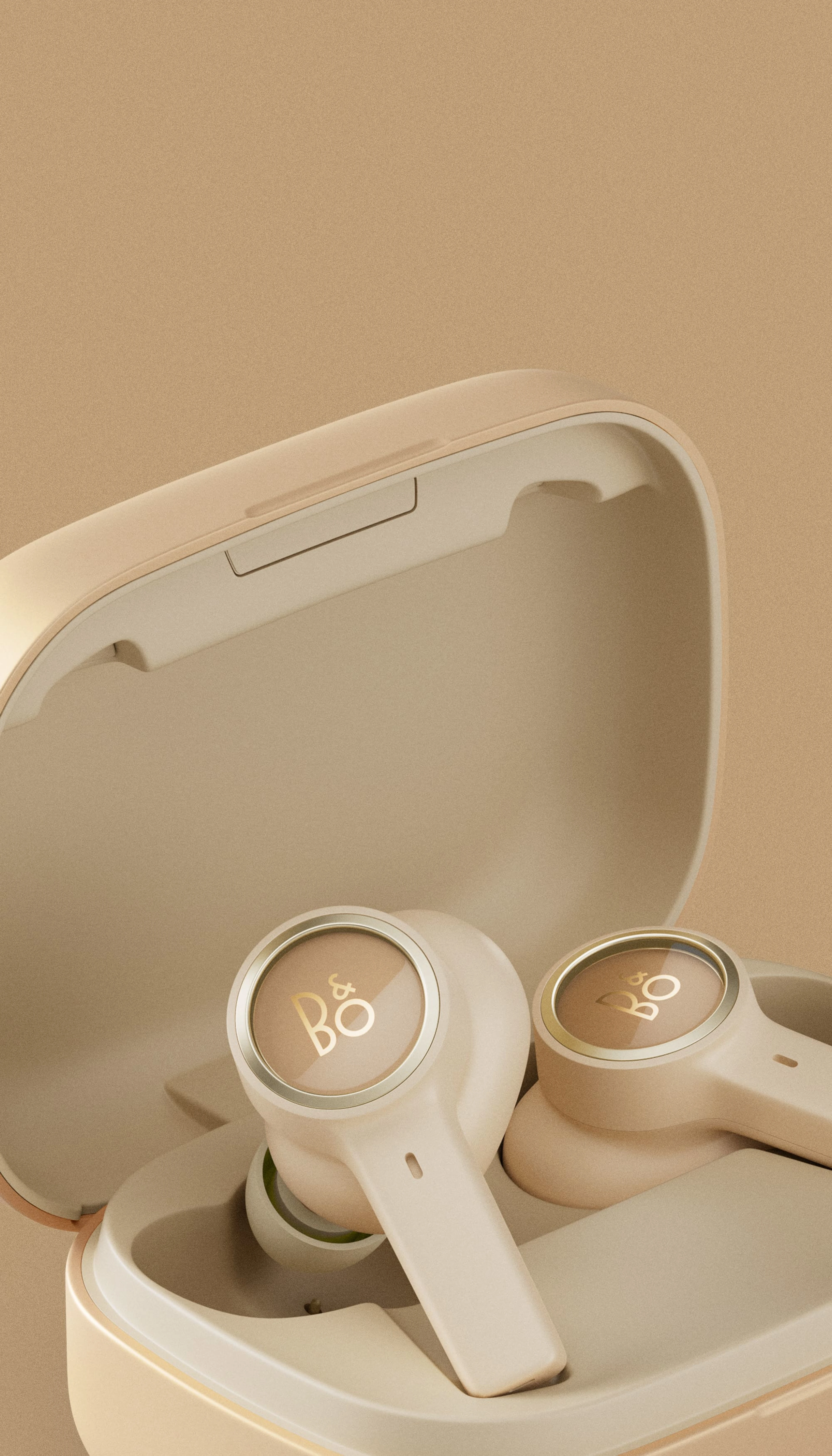 Beoplay EX in gold tone variant laying in charging dongle