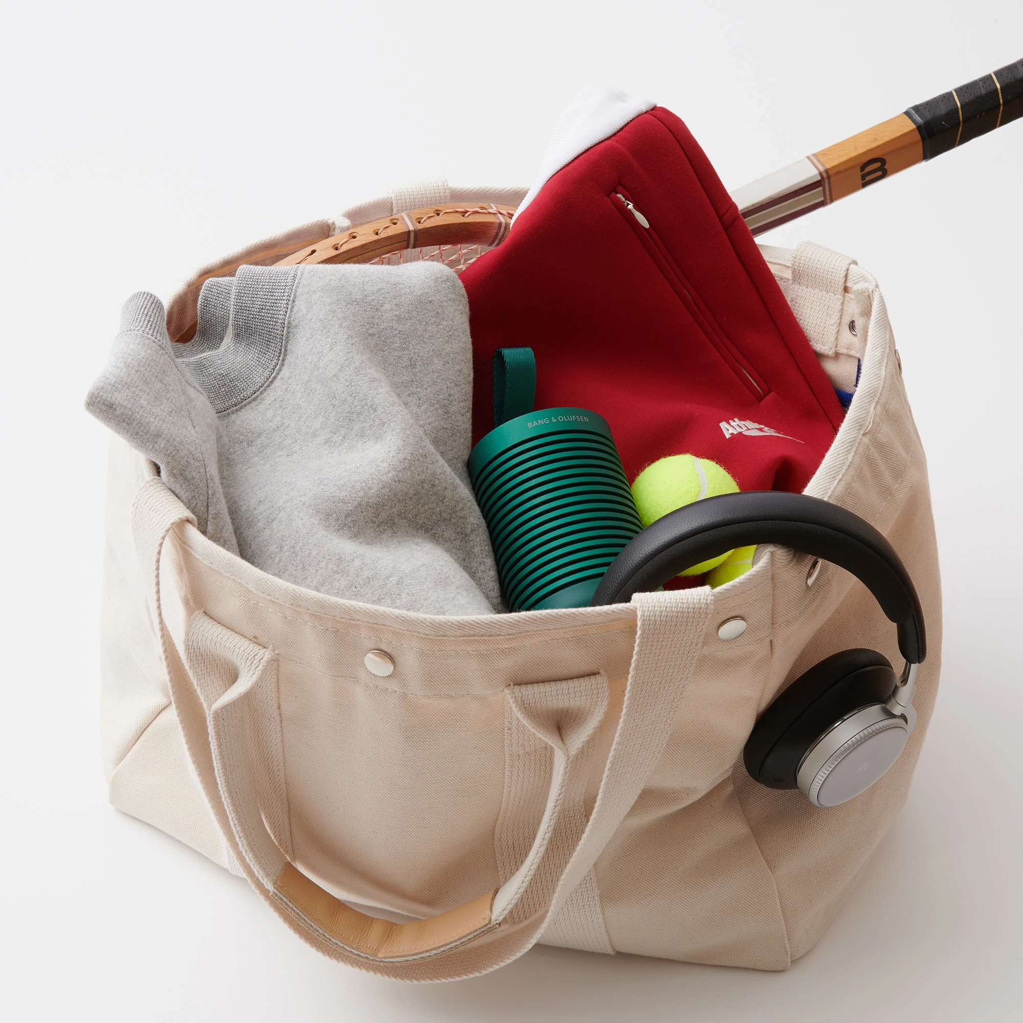 Beosound Explore and Beoplay H100 in a sporty canvas bag