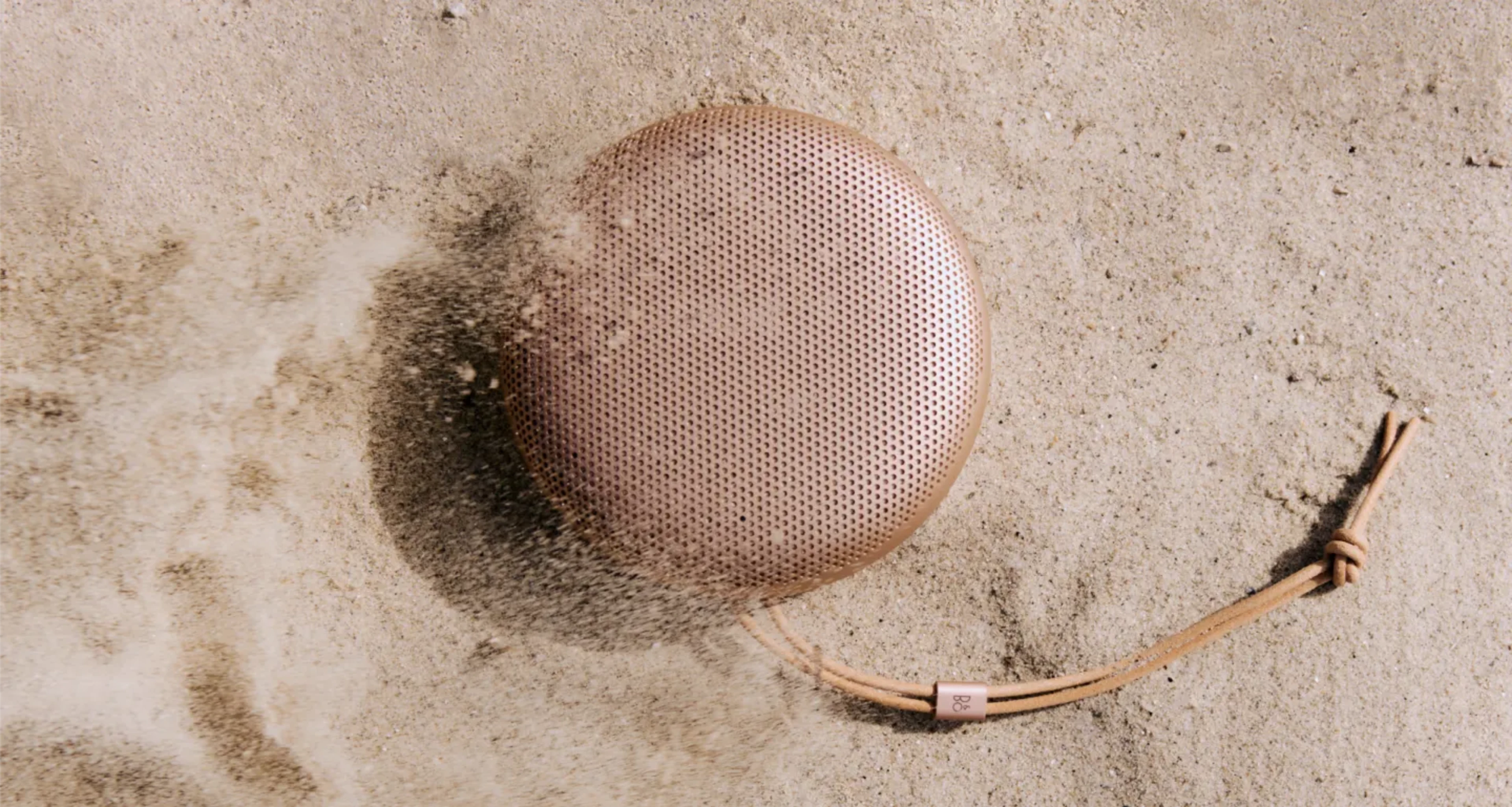 Beosound A1 laying in sand