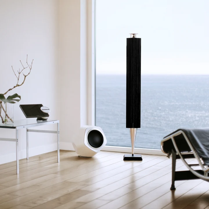 Black beolab 18 speaker in living room with sea in the background