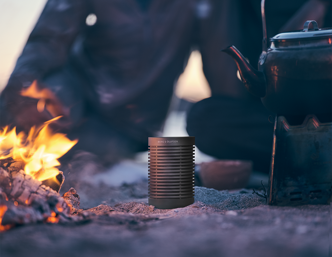 Beosound Explore playing music next to a bonfire