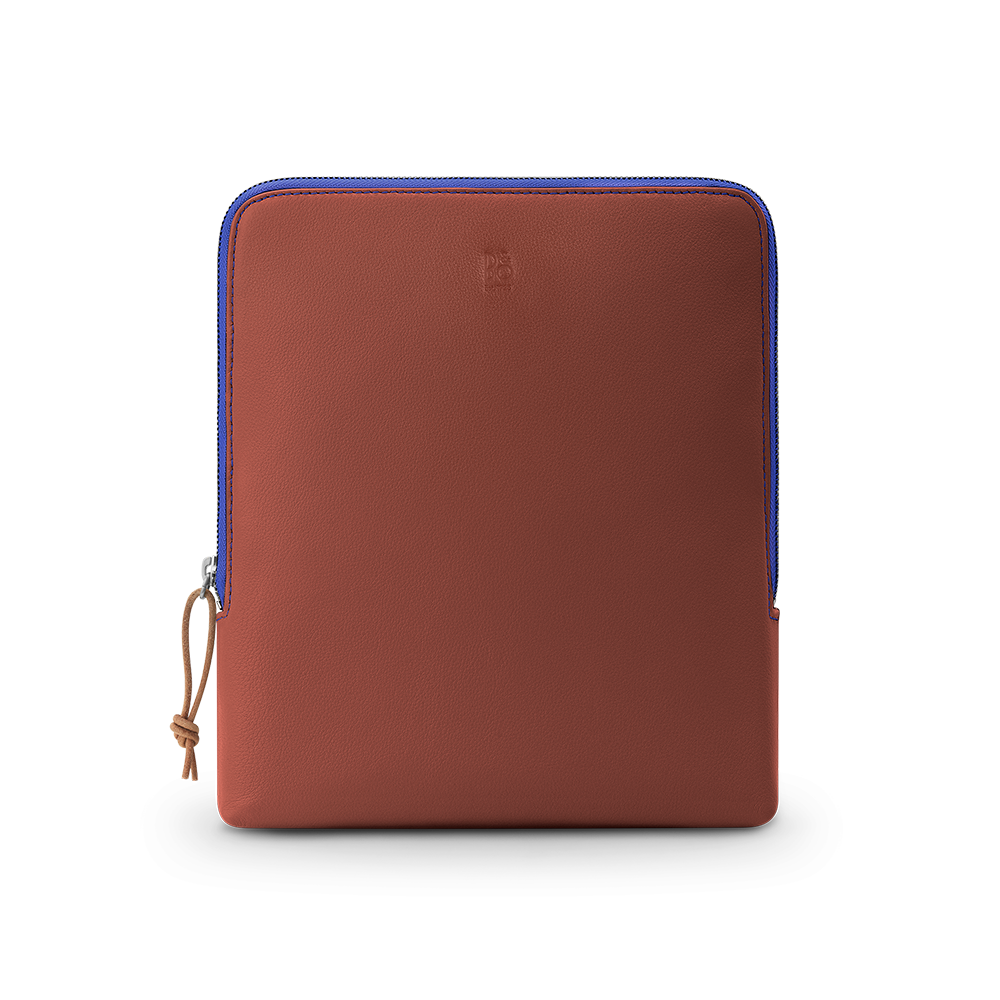 Brown leather Beoplay H100 sleeve with blue zipper trim and tan leather pull tab, displayed against white background.