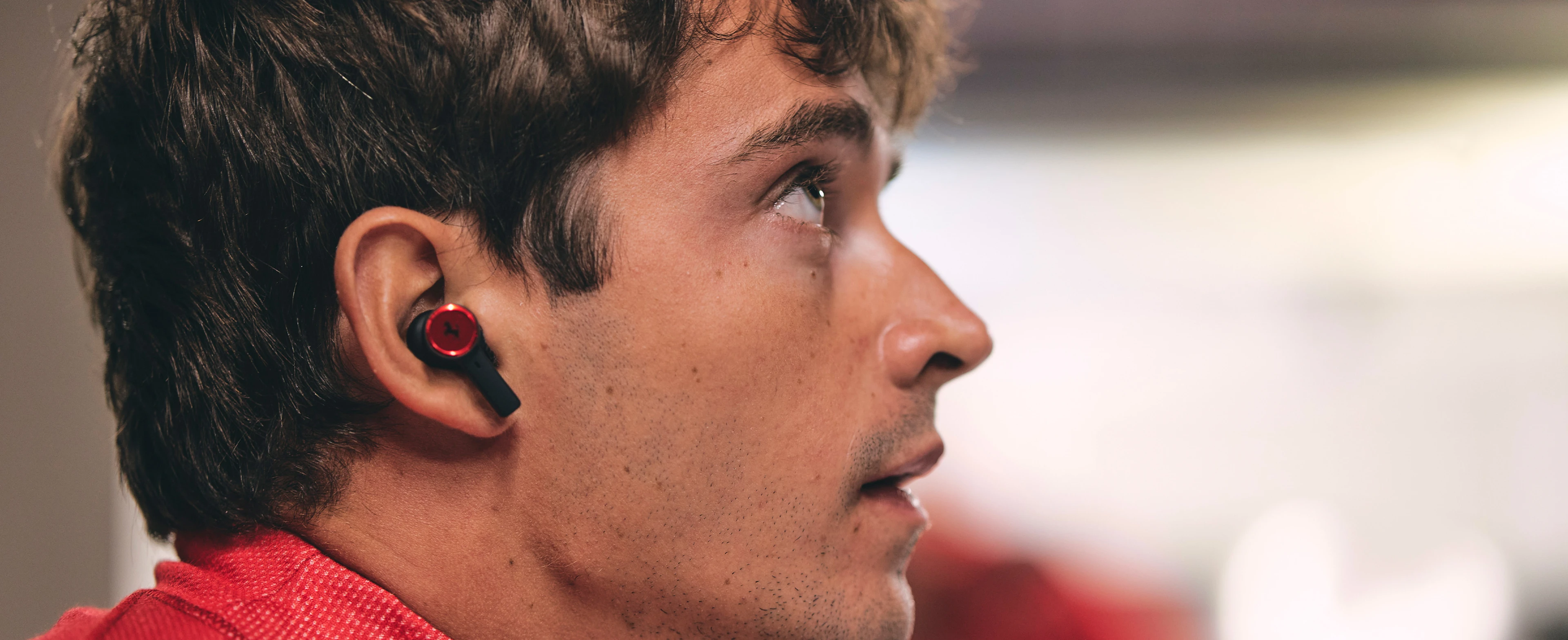 Charles Leclerc wearing Beoplay EX Ferrari edition