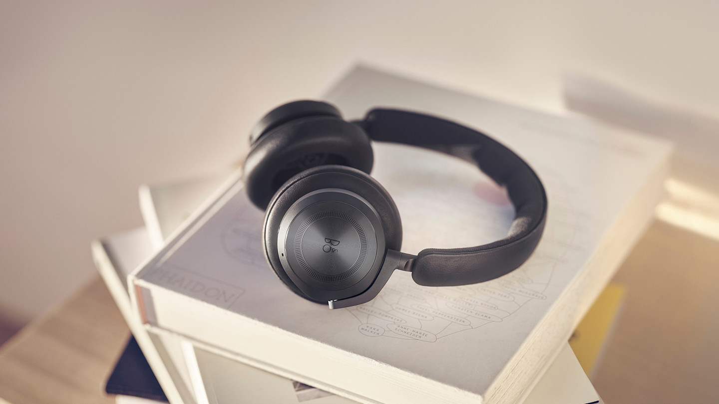 Beoplay HX Black Anthracite on top of books