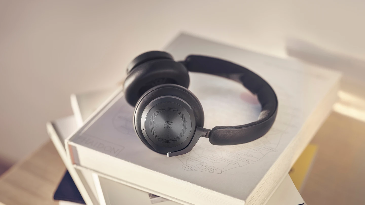 Beoplay HX Black Anthracite on top of books 
