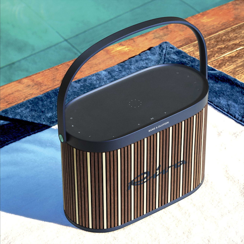 Beosound A5 Riva editioned placed next to a pool