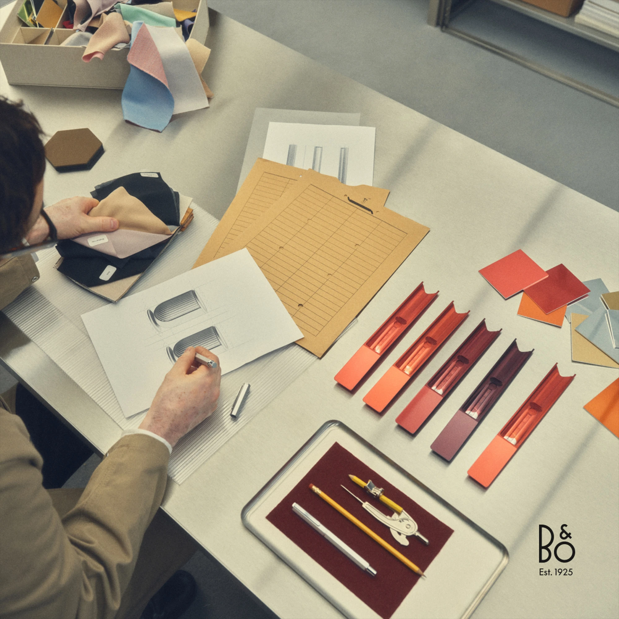 Man drawing a pair of Beolab 8s