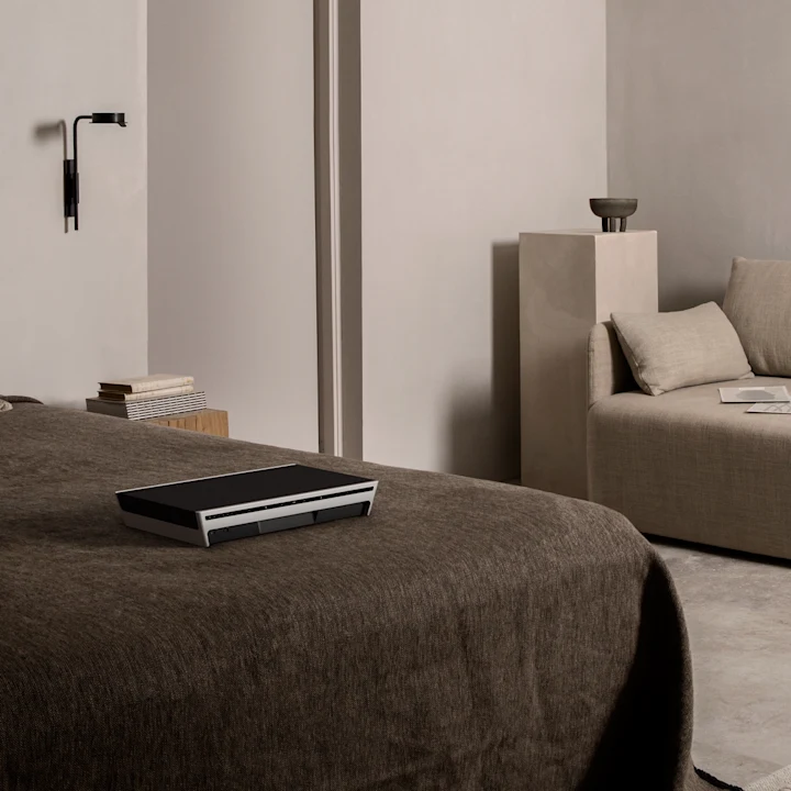 Beosound Level Natural - Dark Grey in a bedroom