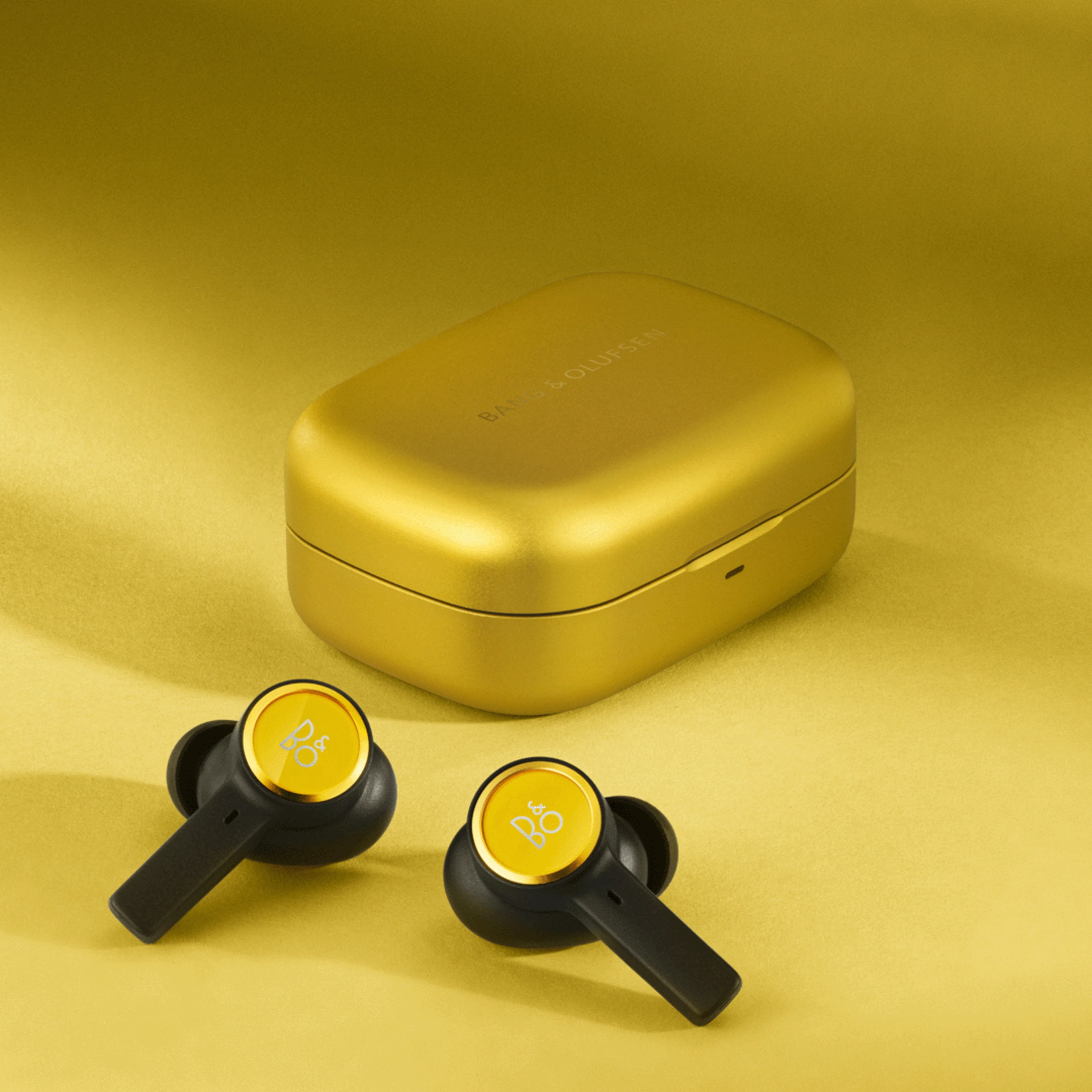 Beoplay EX Atelier closed wireless charging case and earbuds in Pineapple Yellow
