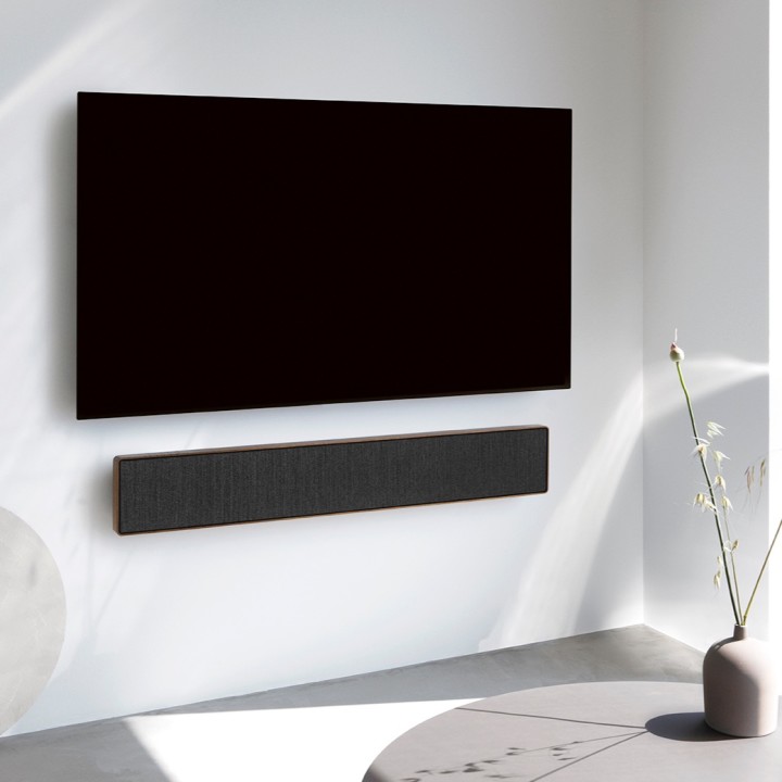 A setup of Beosound Stage and a TV on a wall