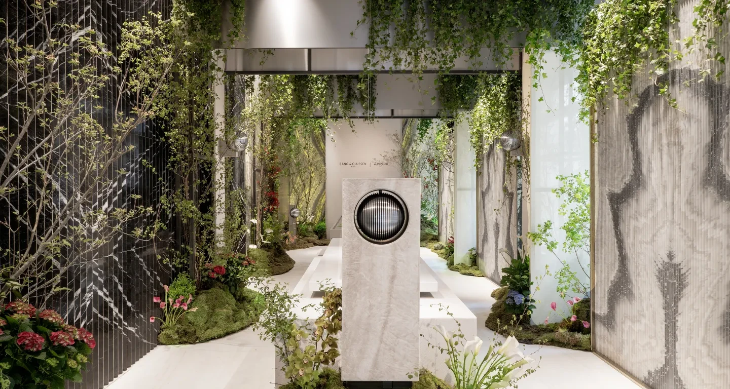 Beosound Haven in a outside environment with plants