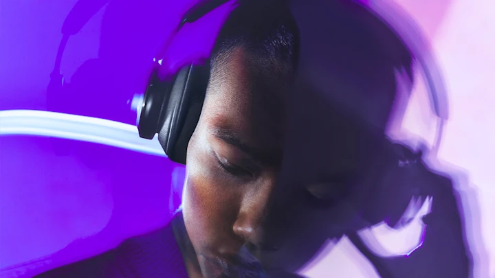 A guy dials in on his Beoplay Portal in Navy
