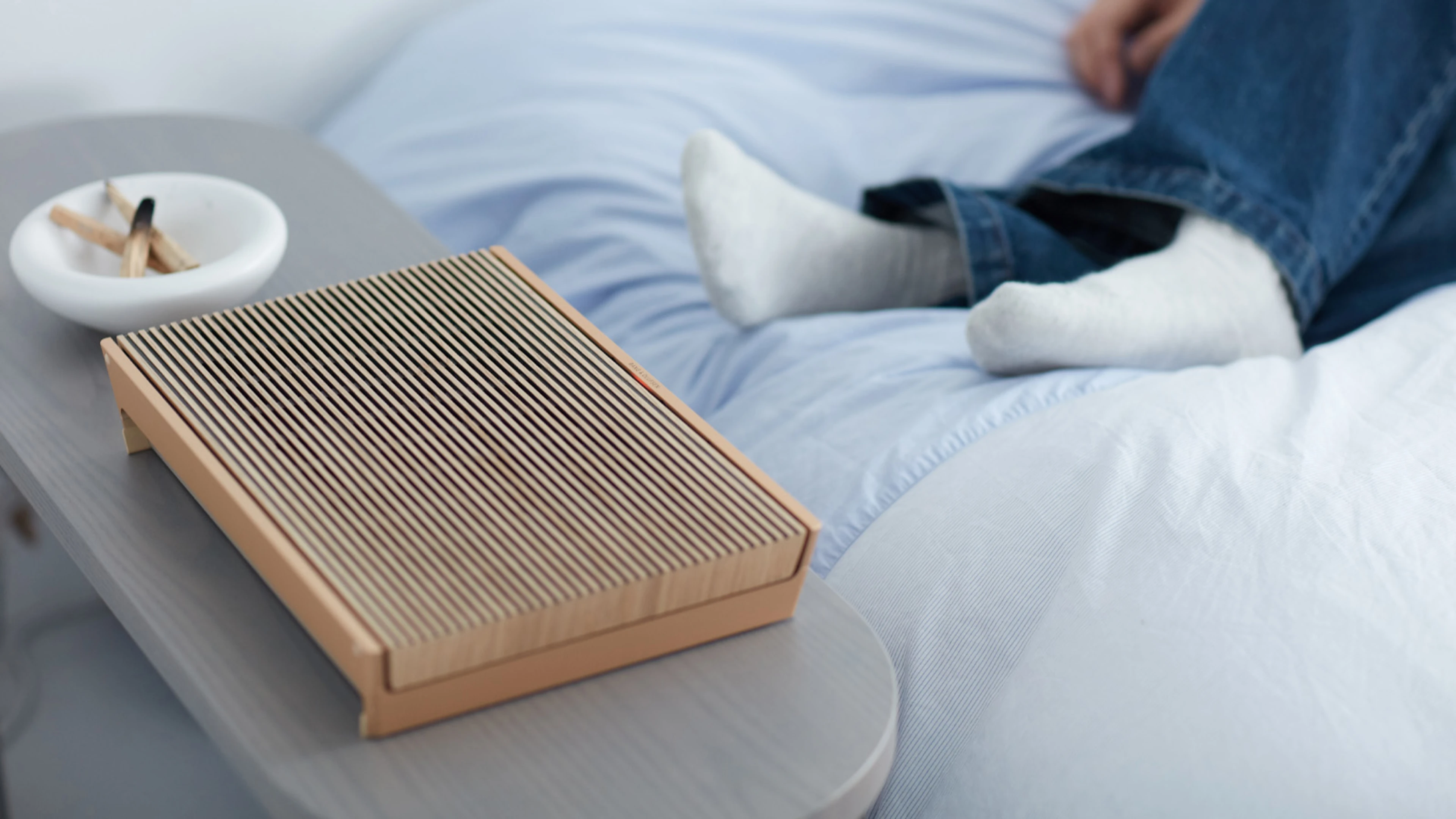 Beosound Level in Gold Tone on a table