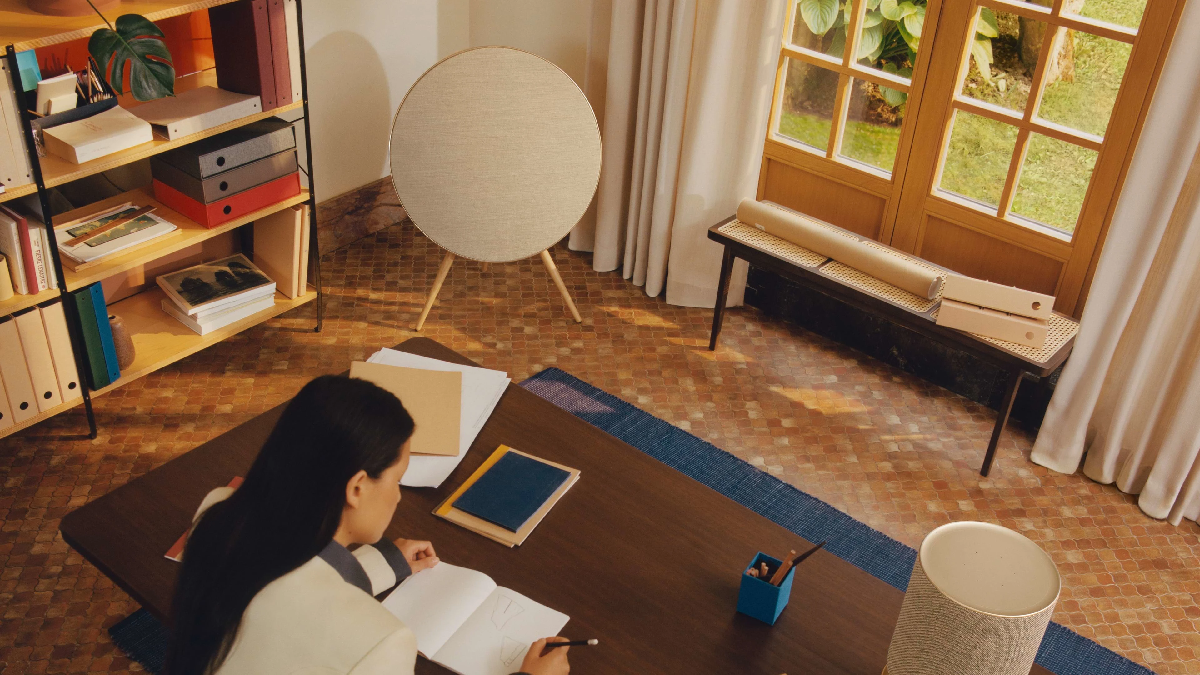 Beosound A9 placed in the corner of a home office