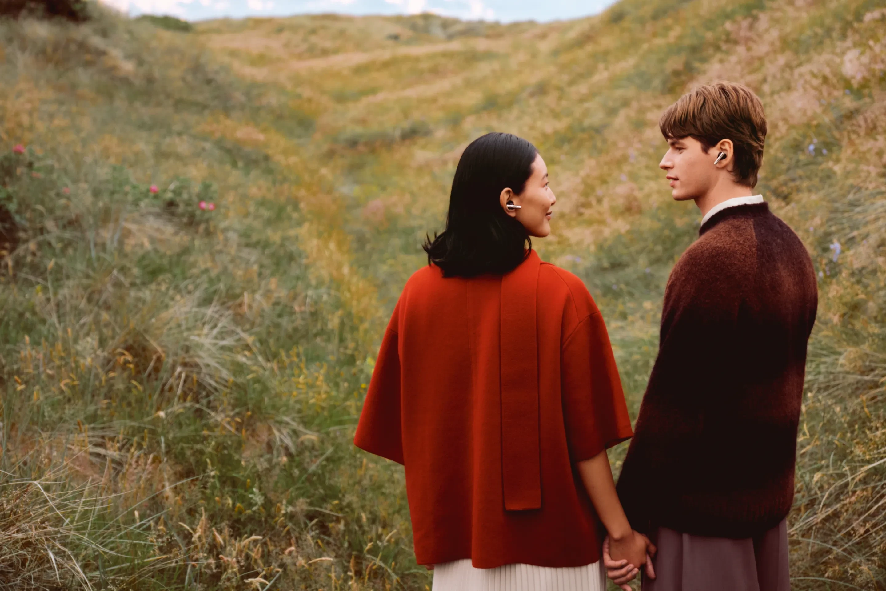 Two people standing next to each other while wearing Beo Grace