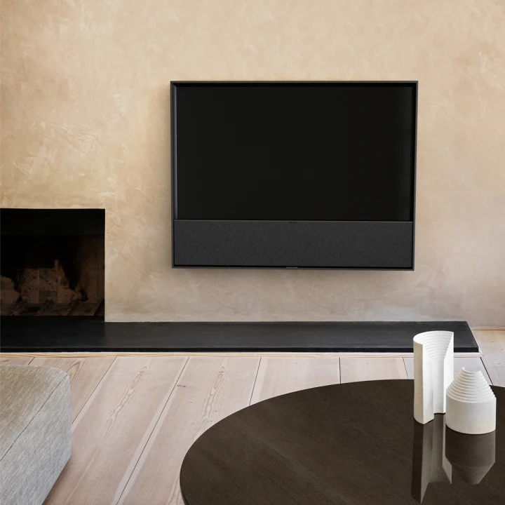 Beovision Contour on a wall in a warm livingroom