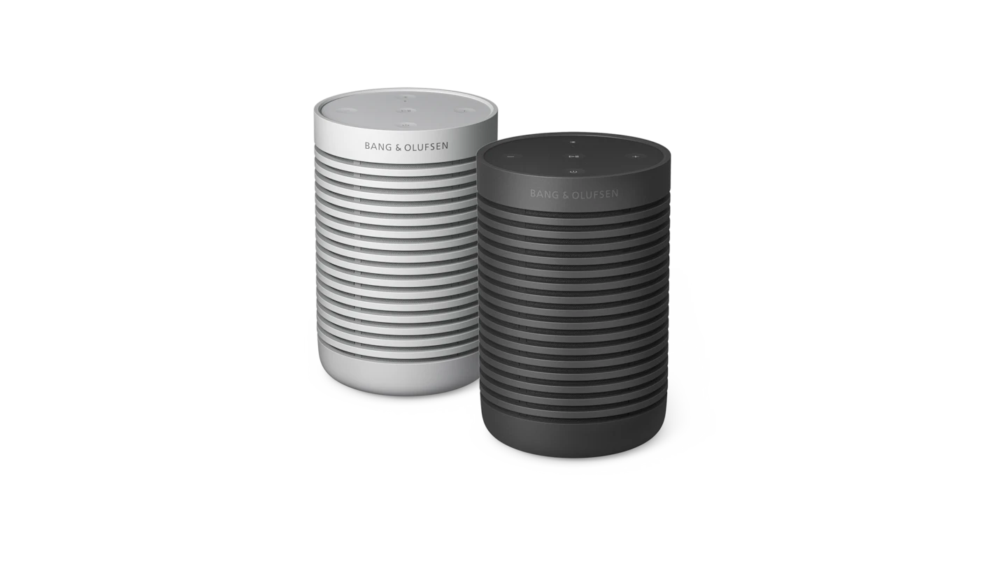 A pair of Beosound Explorer in grey mist and black anthracite