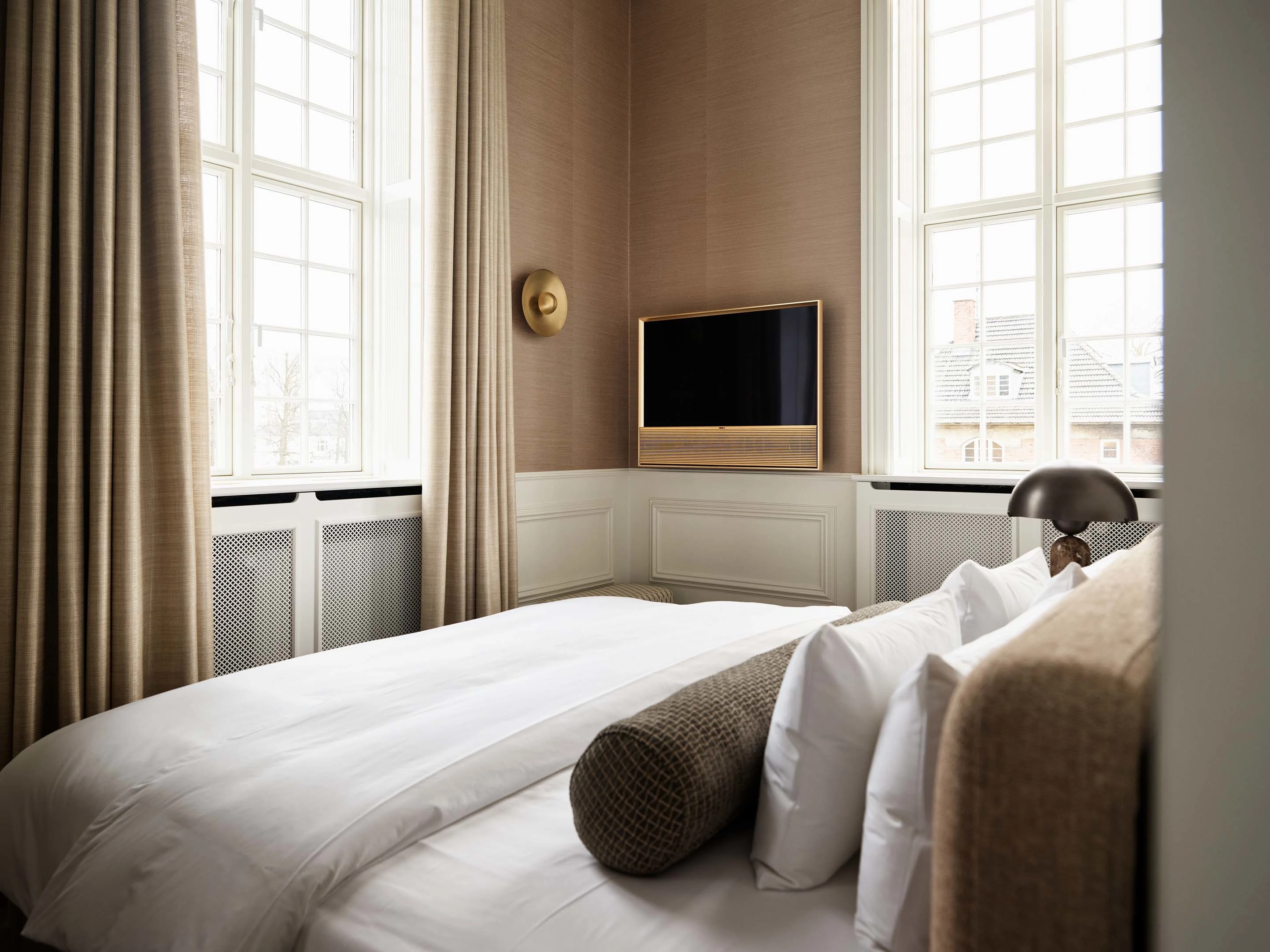 Hotel room with a Bang & Olufsen product displayed in
