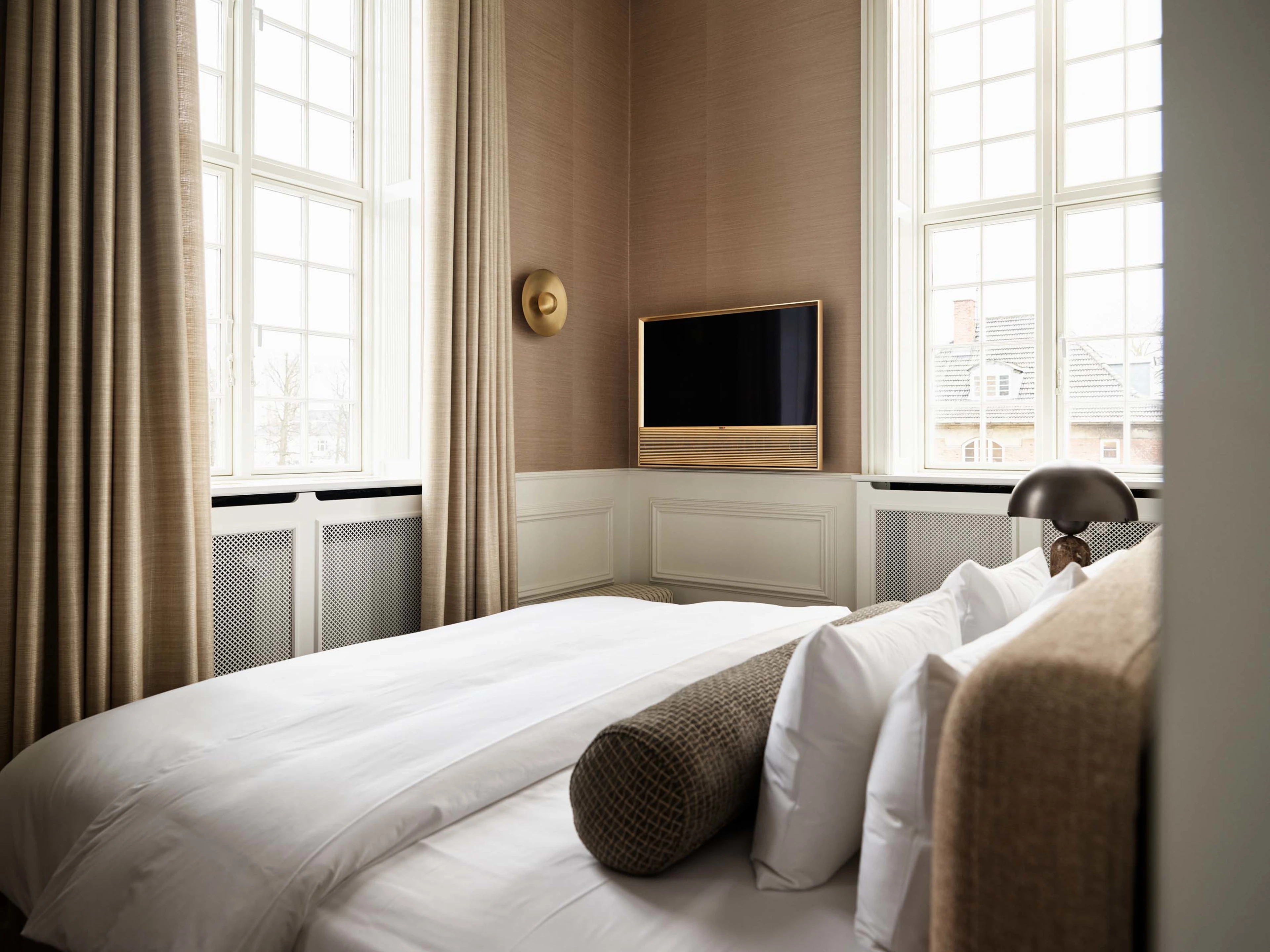 Hotel room with a Bang & Olufsen product displayed in