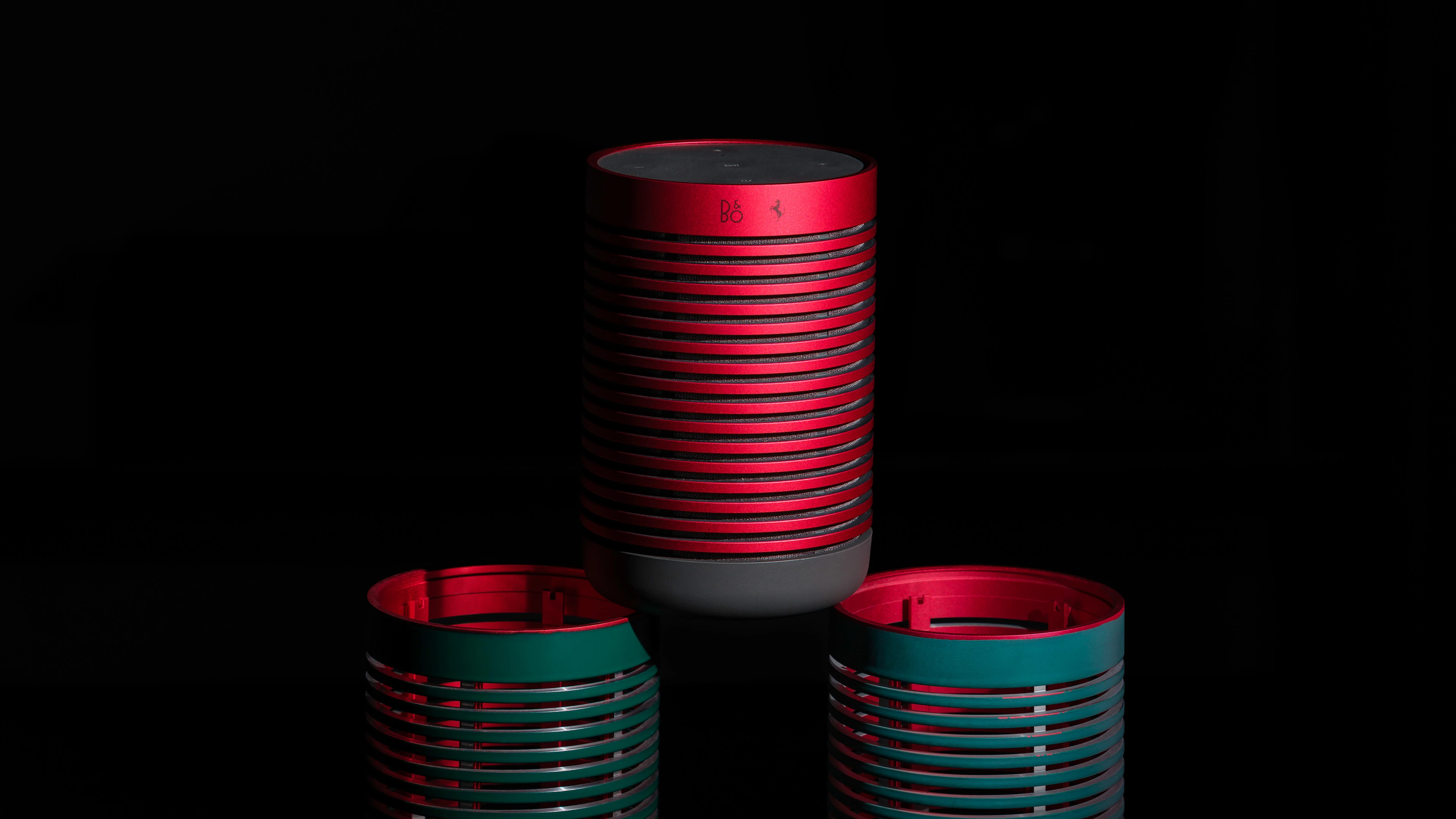Beosound Explore Ferrari edition on a dark background, emphasizing the red color