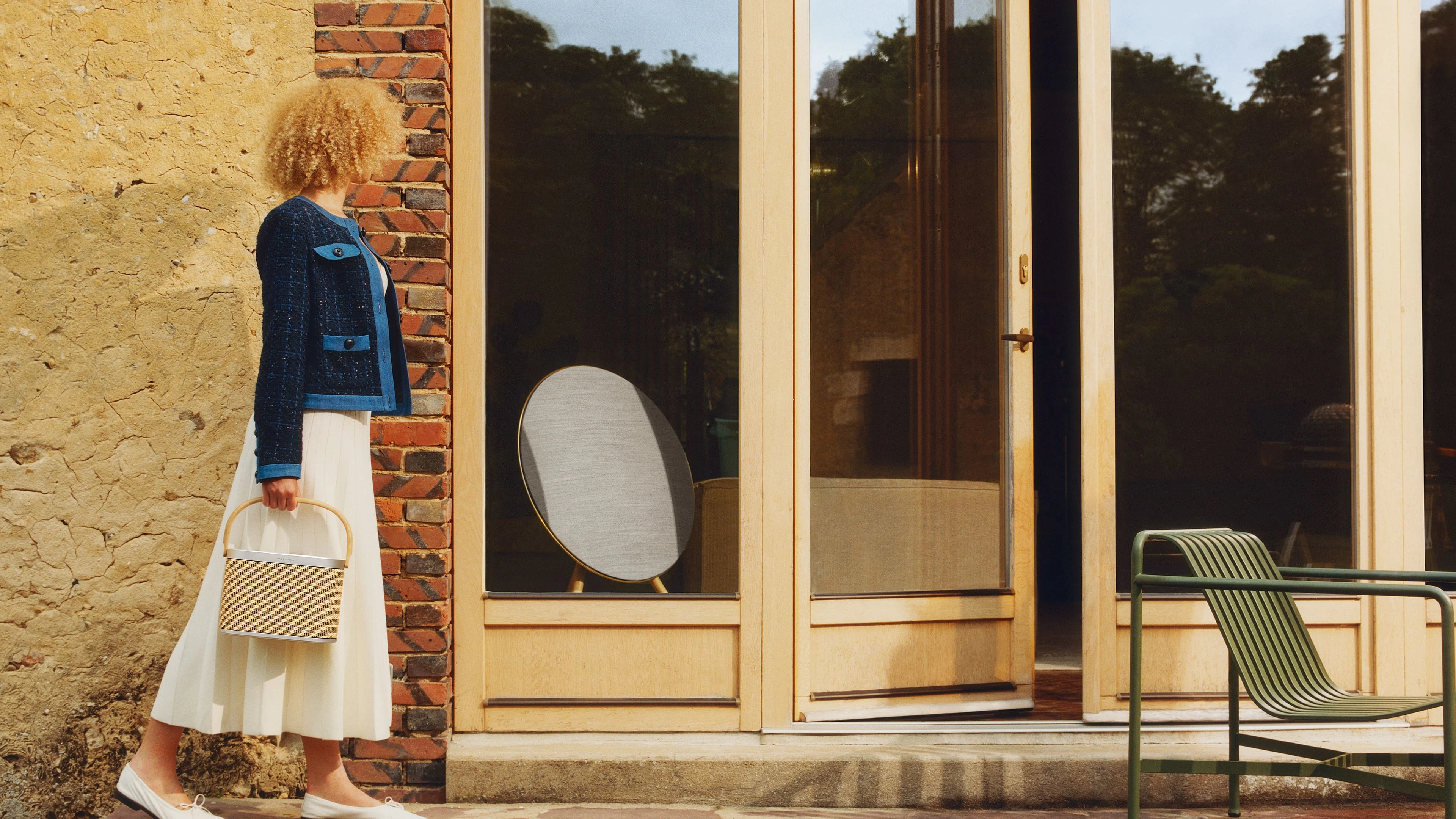 Beosound A9 viewed from the yard through a window