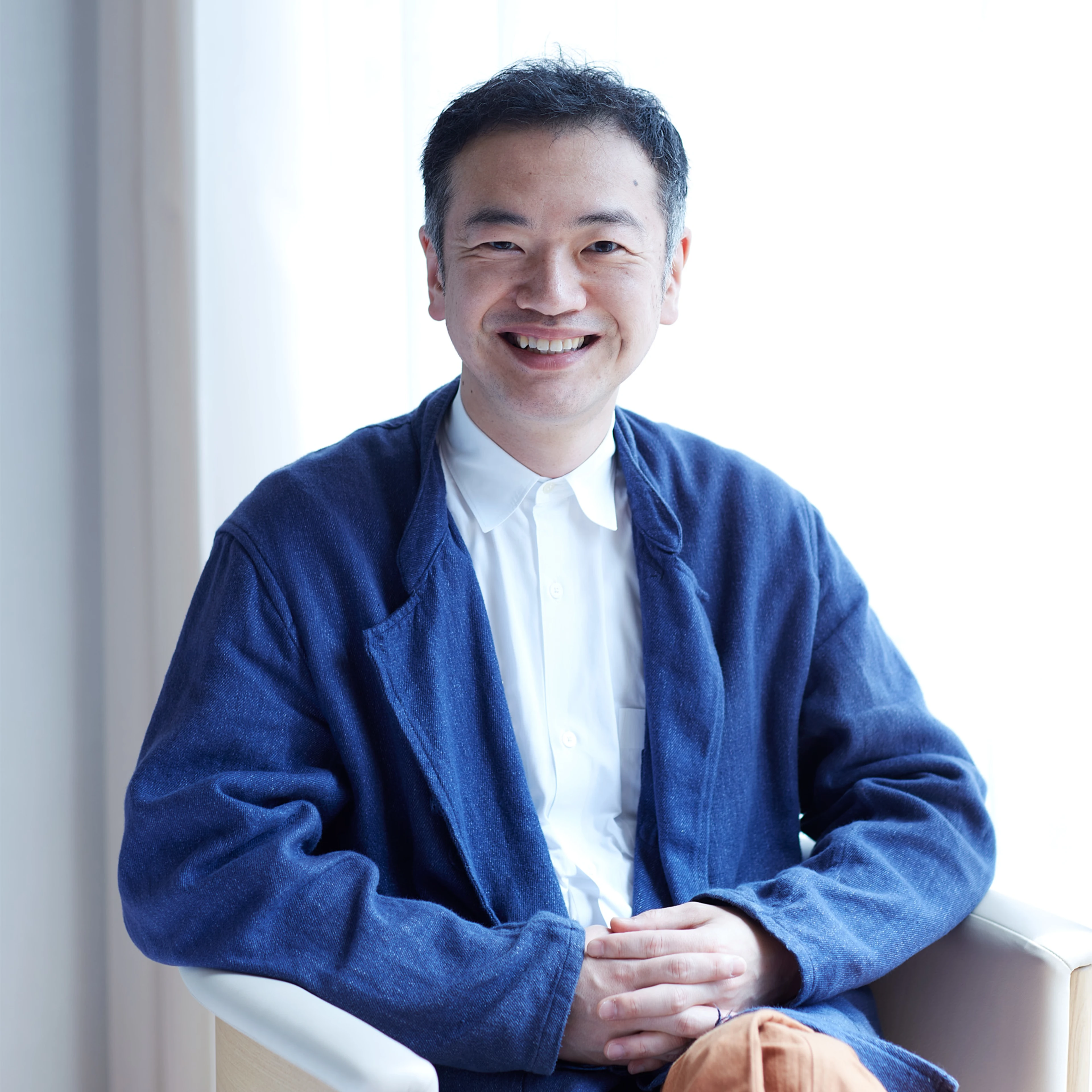 Image of man sitting in a chair