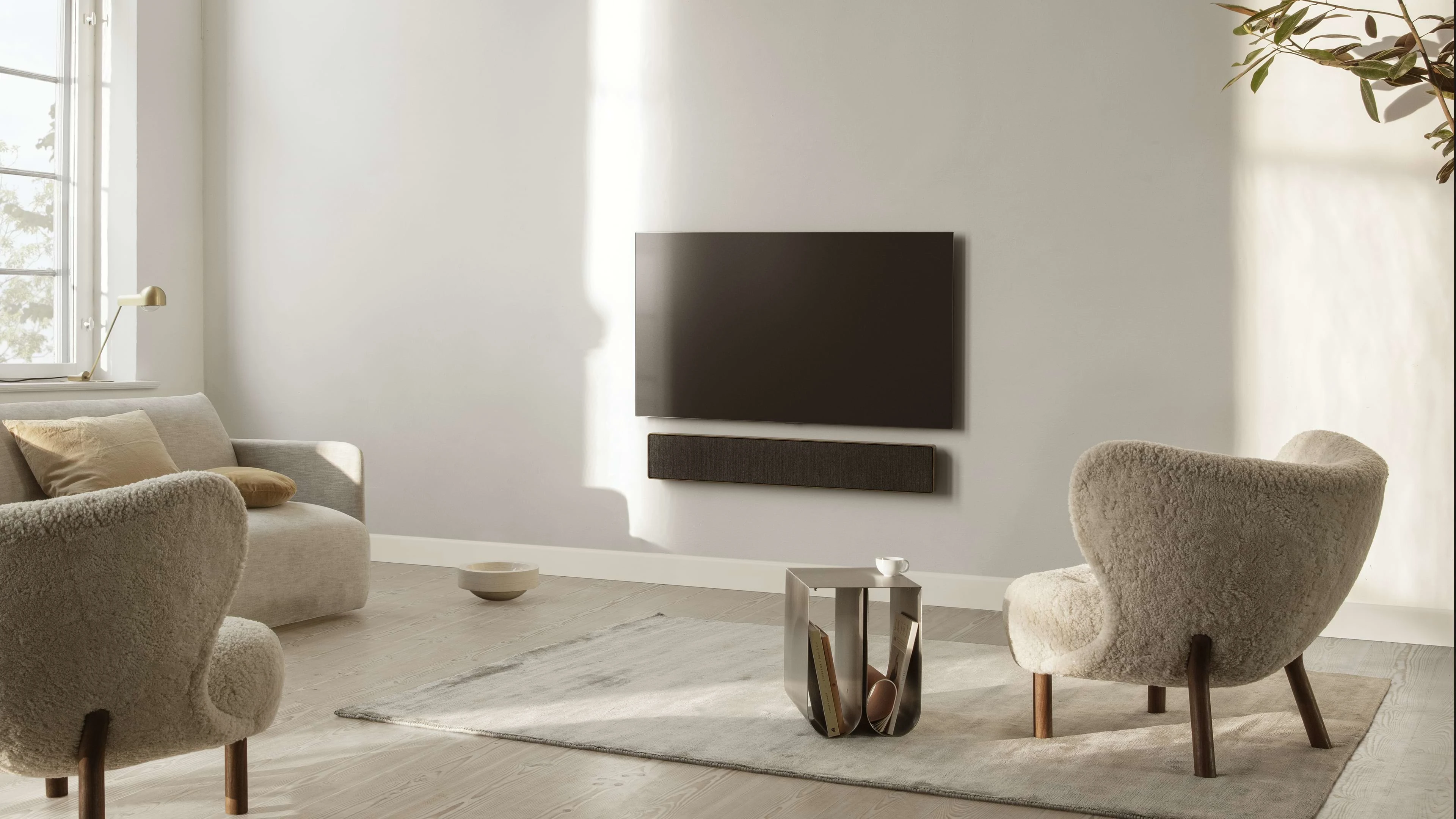 Beosound stage displayed on the wall in a living room
