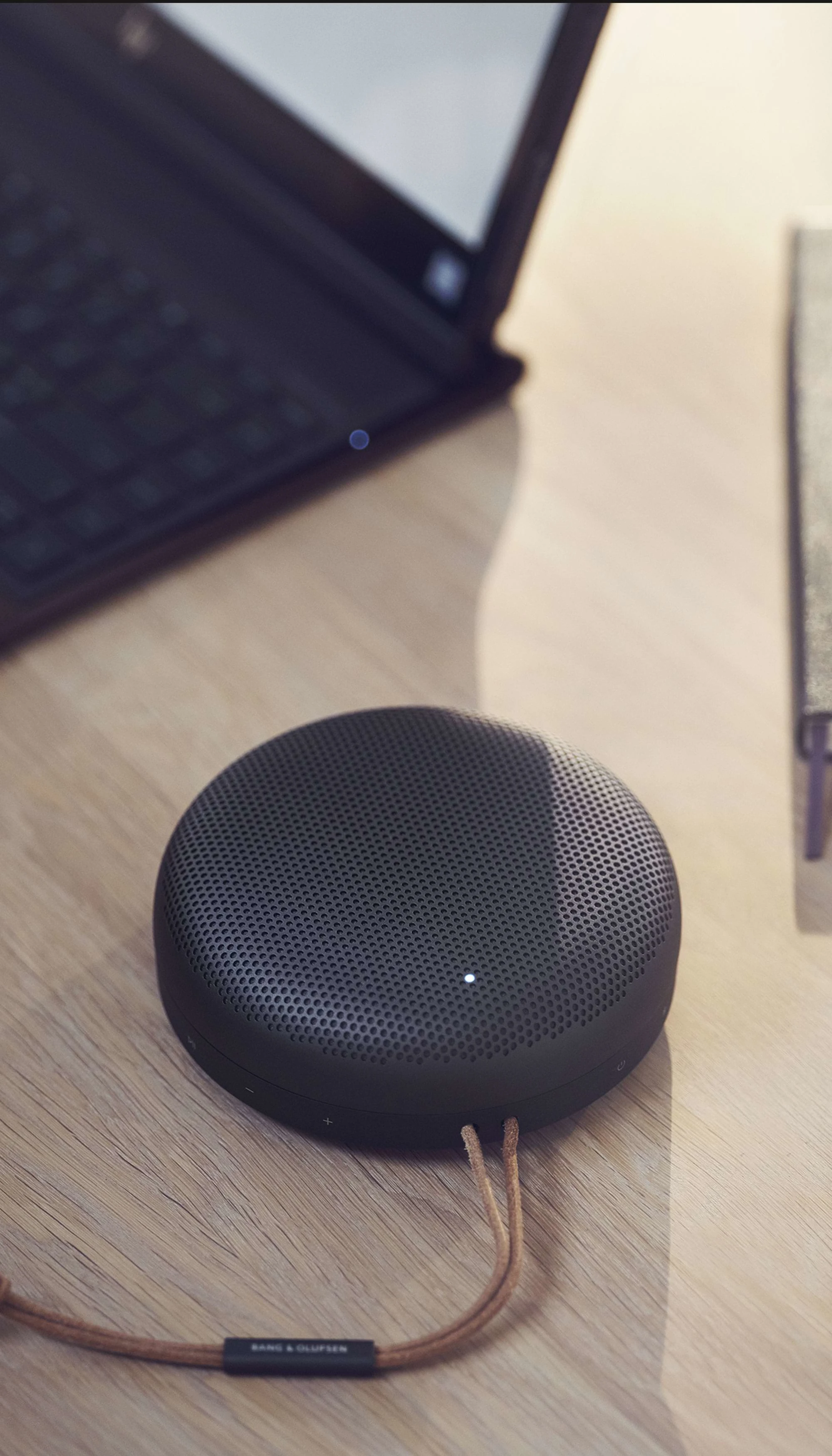 Beosound a1 on a wooden desk