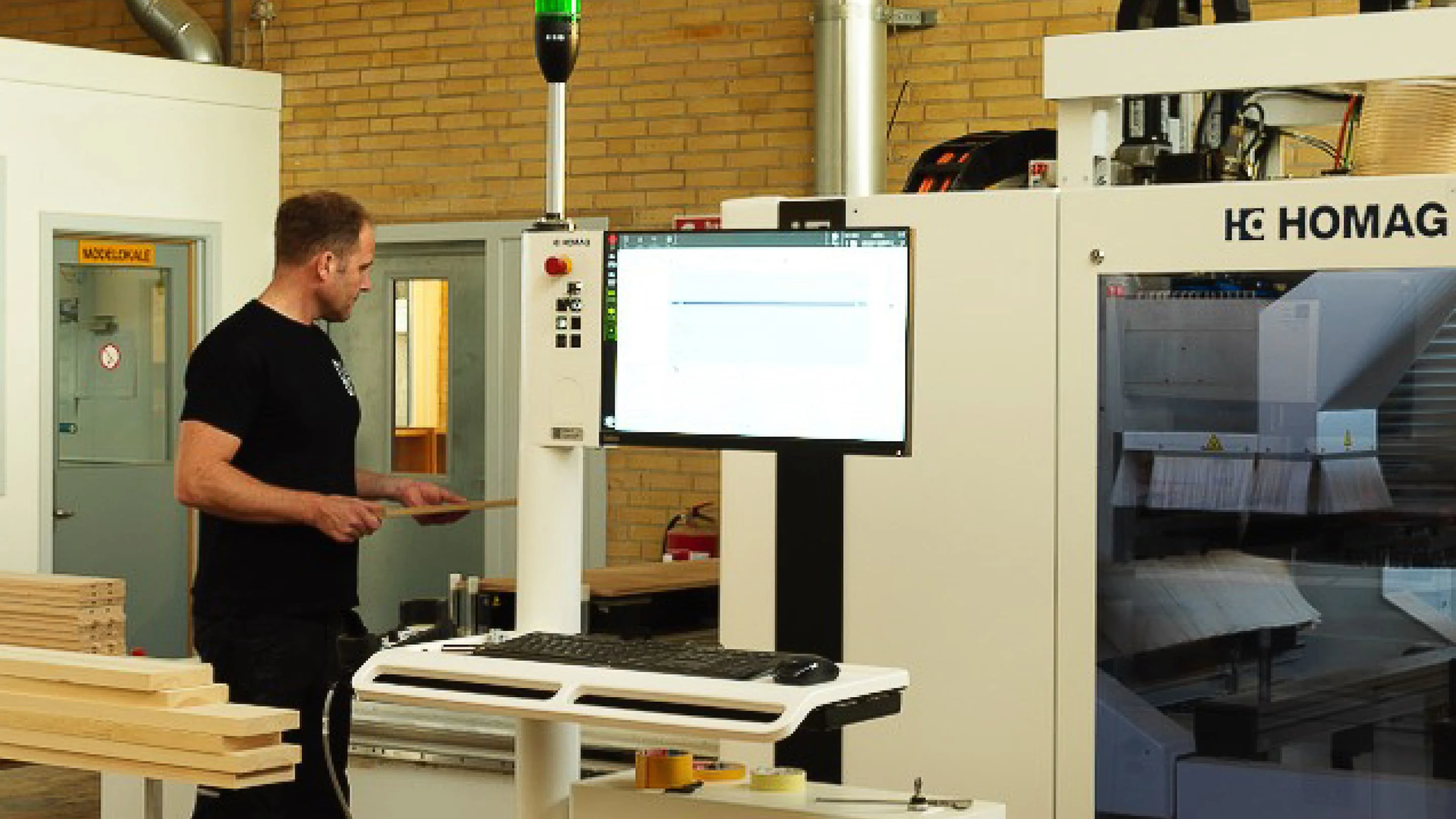 Person standing at a computer