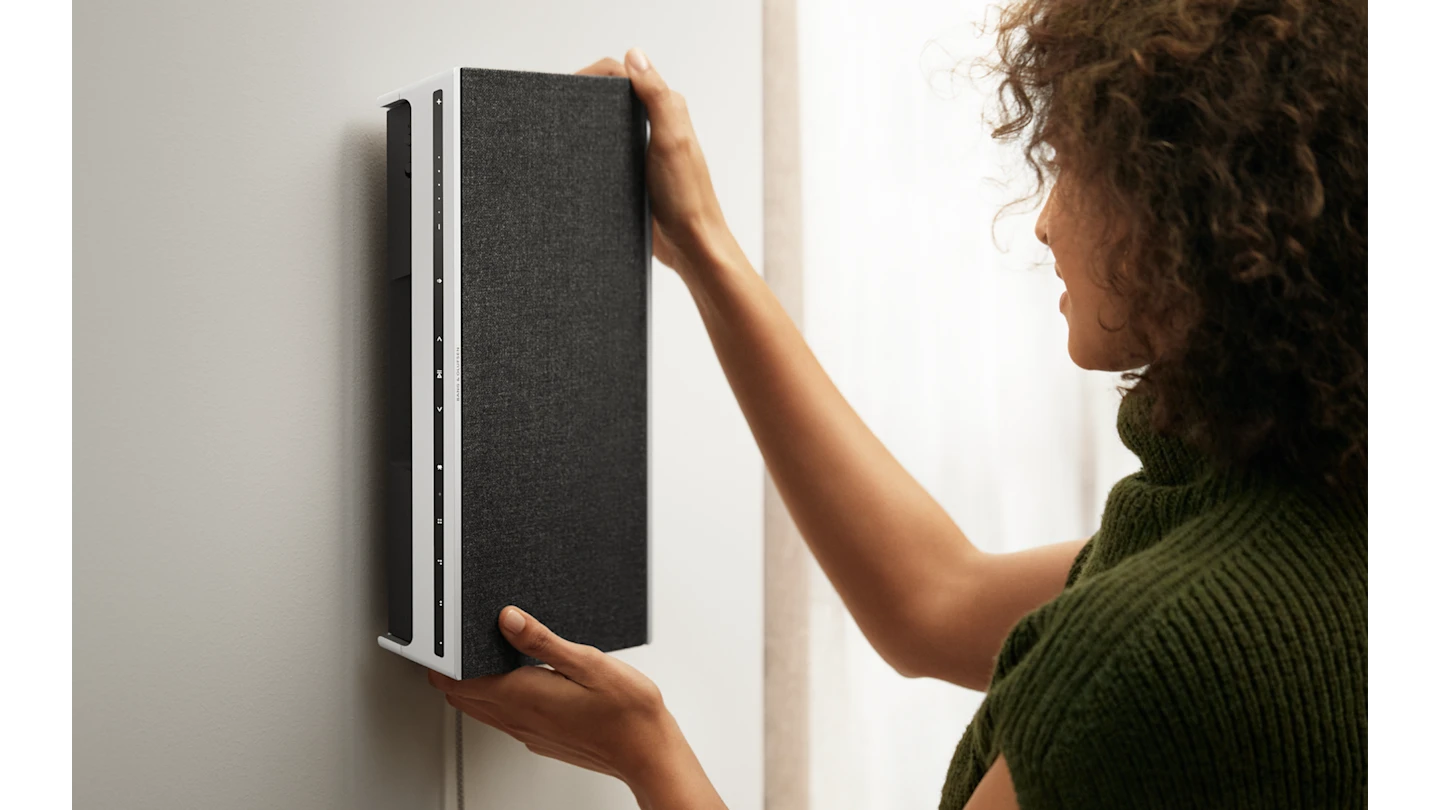 Beosound Level Natural - Dark grey placed on a wall bracket