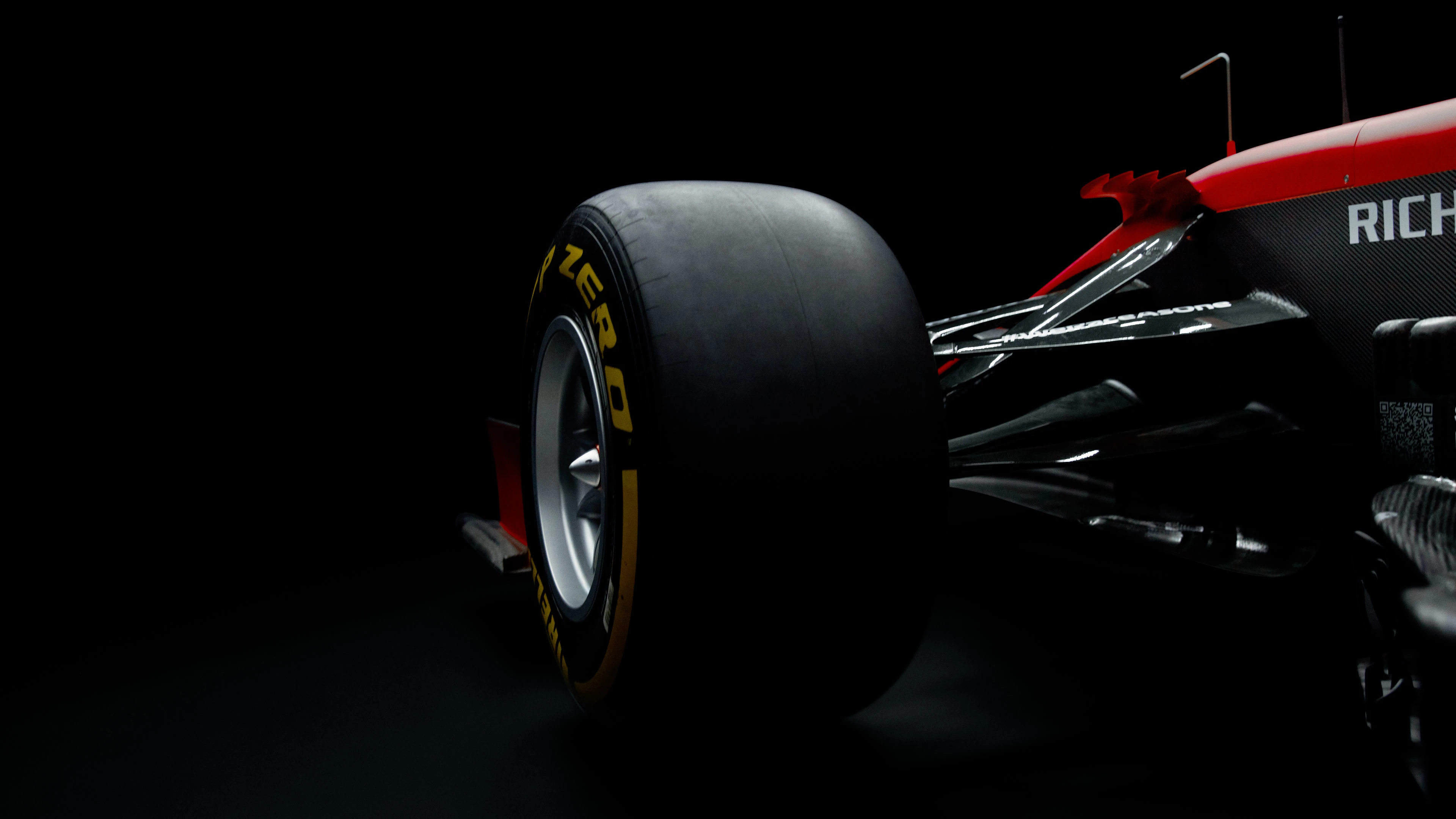 Image of the back wheel of a Scuderia Ferrari racing car