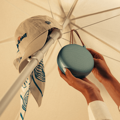 Beosound A1 3rd Gen hanging on an umbrella