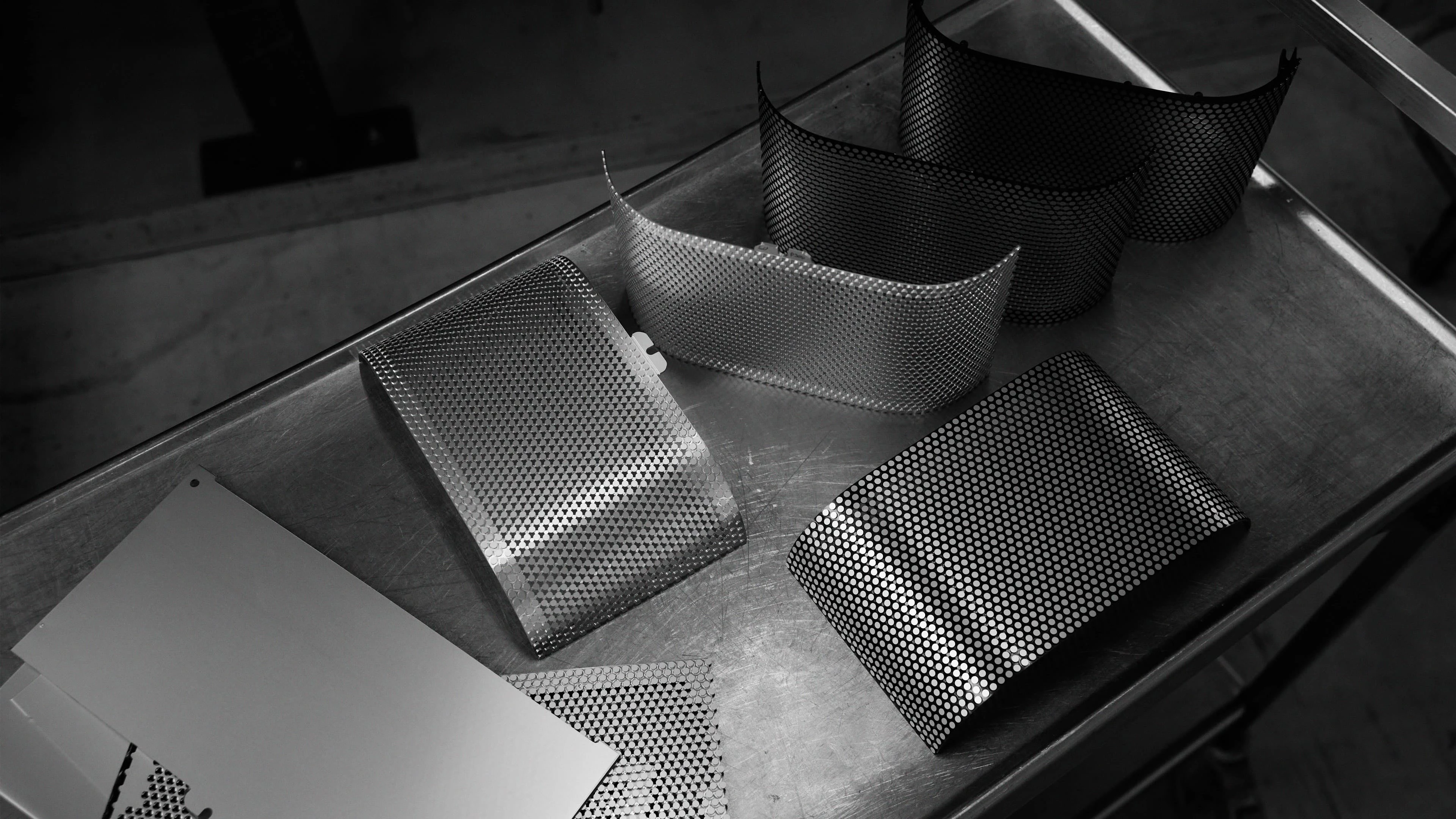 Image of Beosound A5 speaker covers in Spaced Aluminium on an aluminium table