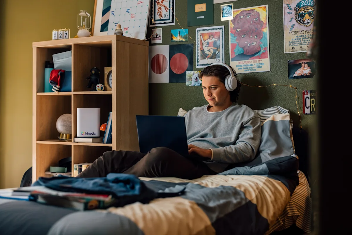 Man in bed on laptop