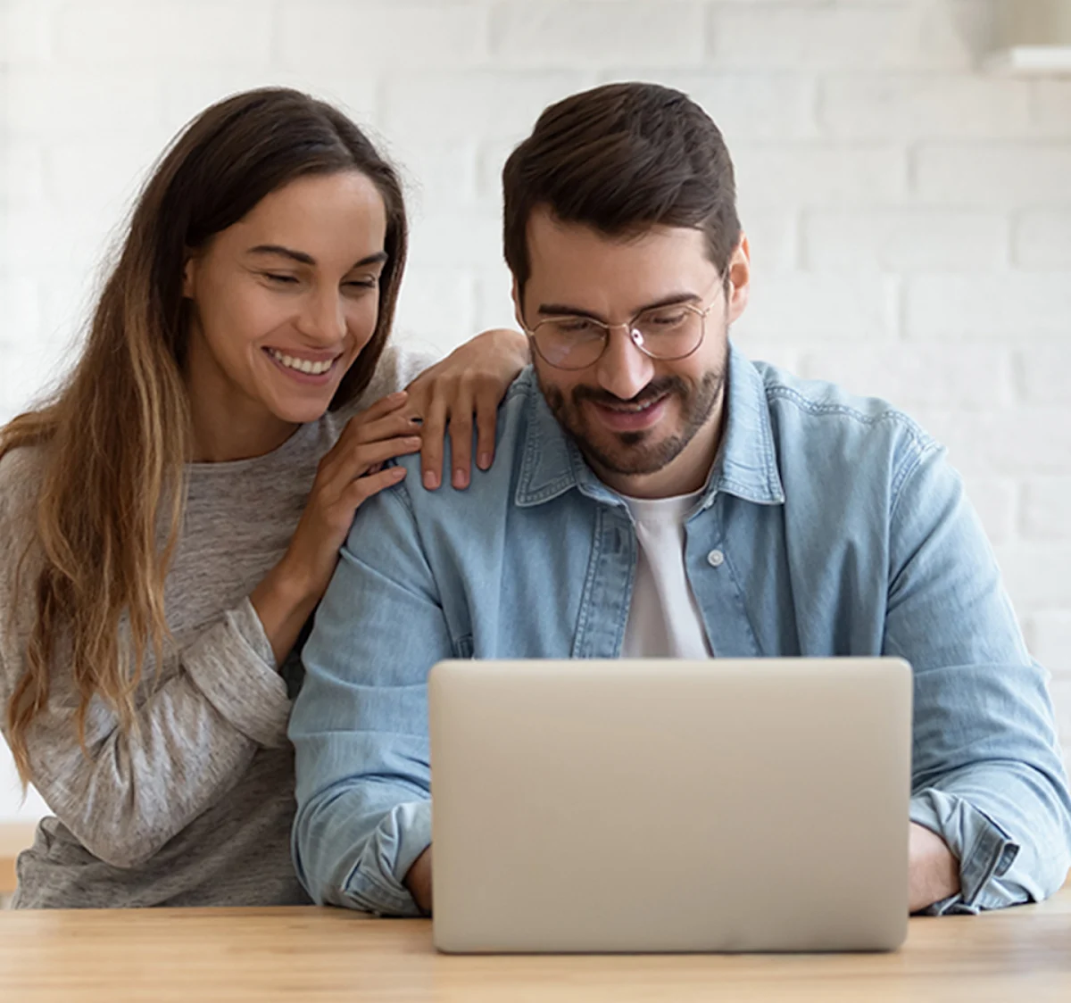 couple viewing laptop