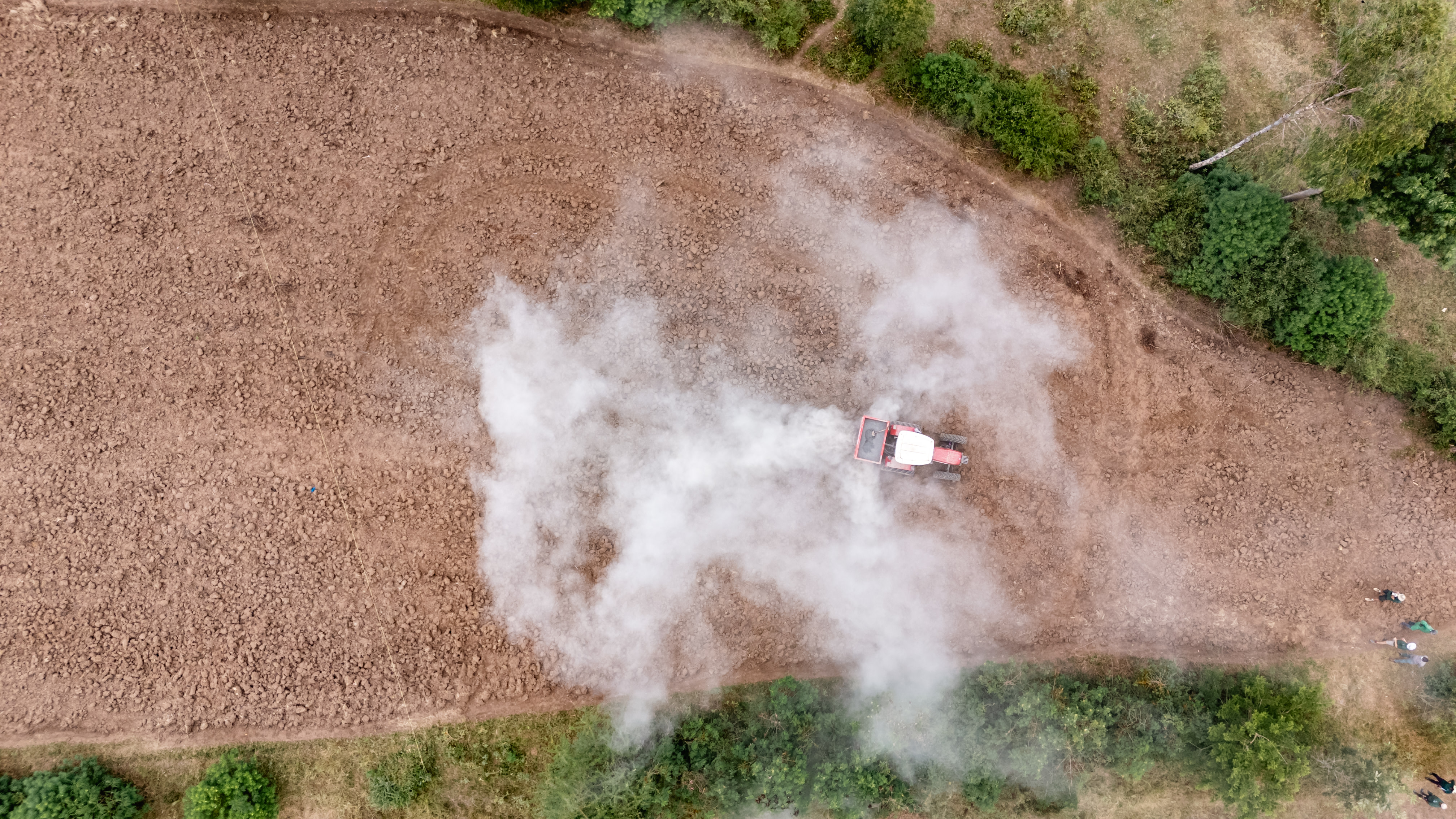 A tractor from Flux working in a field.