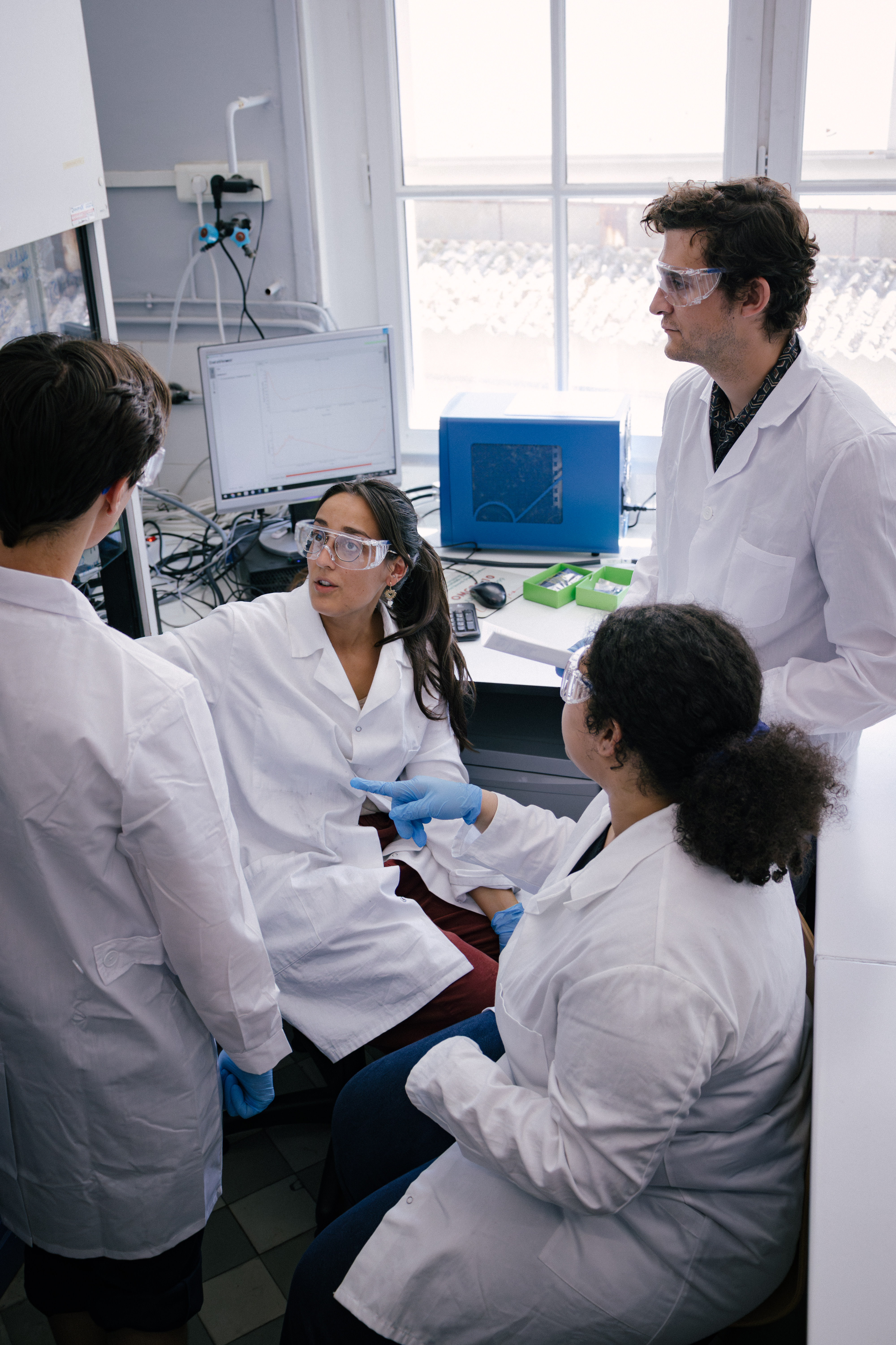 Norma scientists talking in a lab