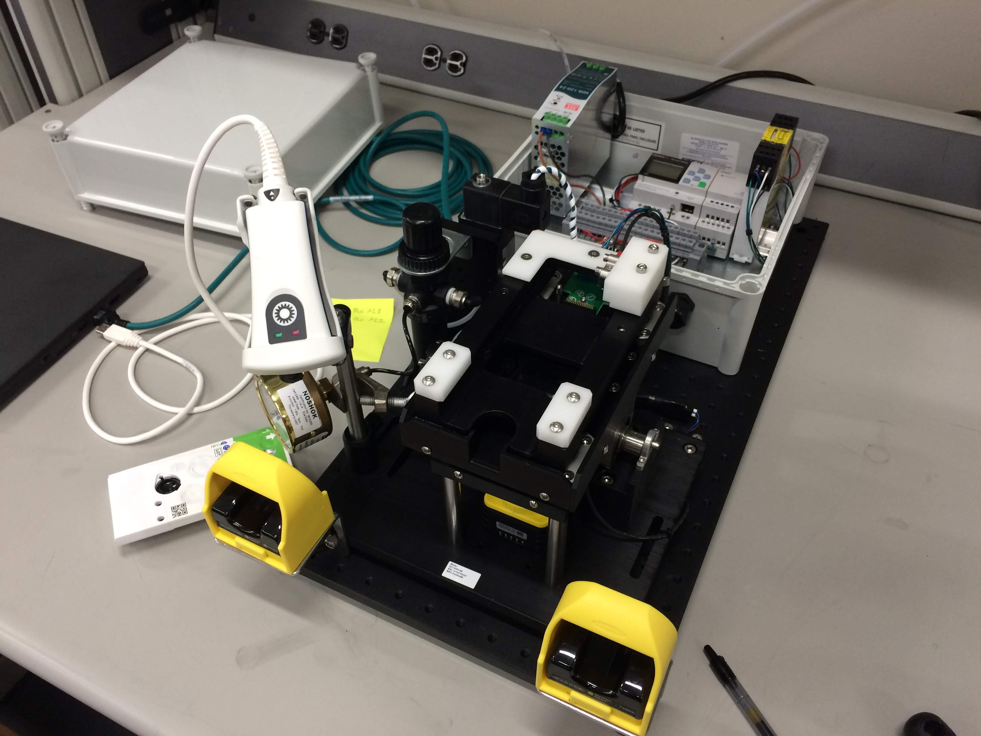 I designed and built a fixture for programming UUIDs onto a PCB integrated into a microfluidic assembly