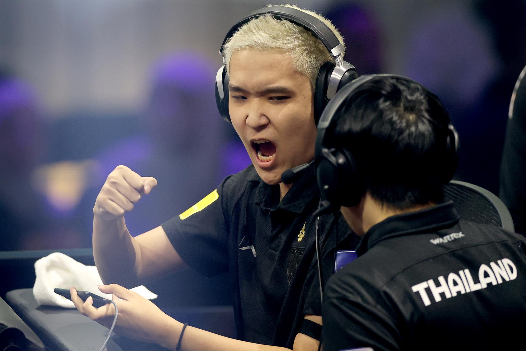 JXMKT with coach celebrates goal