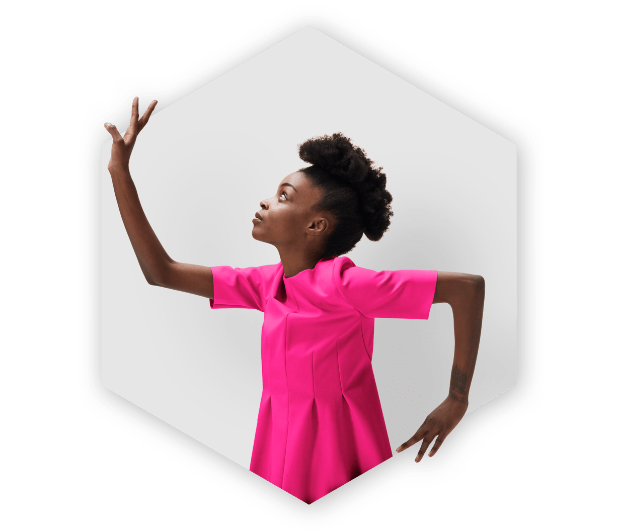 Woman dressed in pink standing inside a hexagon shape