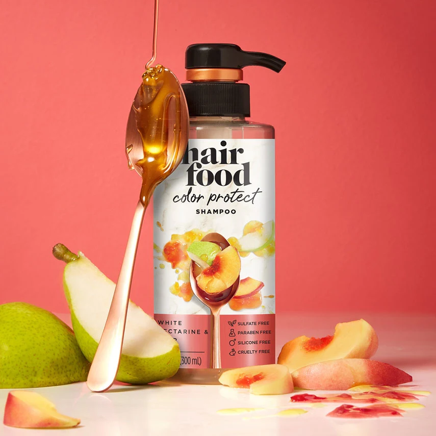 Hair Food White Nectarine & Pear Color Protect Shampoo bottle with white nectarine and pear ingredients