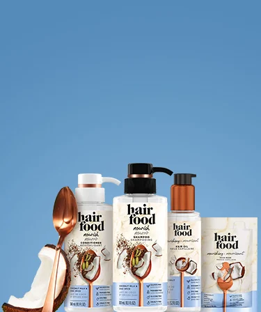 Hair Food Nourish Collection Products on a marble background.